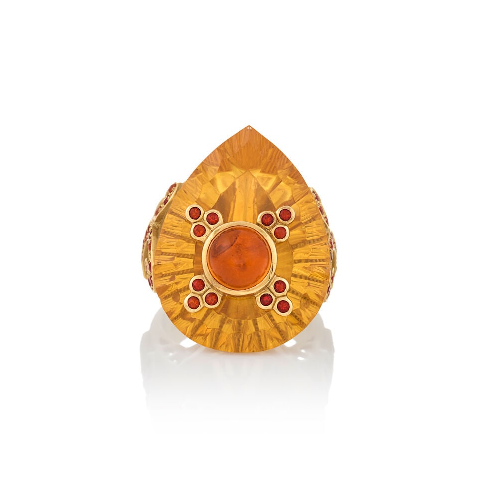 PAULA CREVOSHAY: AN 18K GOLD AND FIRE OPAL RING: PAULA CREVOSHAY: AN 18K GOLD AND FIRE OPAL RING Set with a large, pear shape fire opal, topped by a bezel-set cabochon and circular-cut fire opals, weight 15.2 dwt, signed Crevoshay for Paula Crevosha