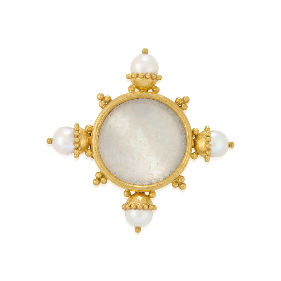 ELIZABETH LOCKE: AN 18K GOLD, MOTHER-OF-PEARL, AND CULTURED PEARL BROOCH: ELIZABETH LOCKE: AN 18K GOLD, MOTHER-OF-PEARL, AND CULTURED PEARL BROOCH Centering an 18th century carved gambling counter of engraved mother-of-pearl, bezel-set, with cultured pearl and applied bead 