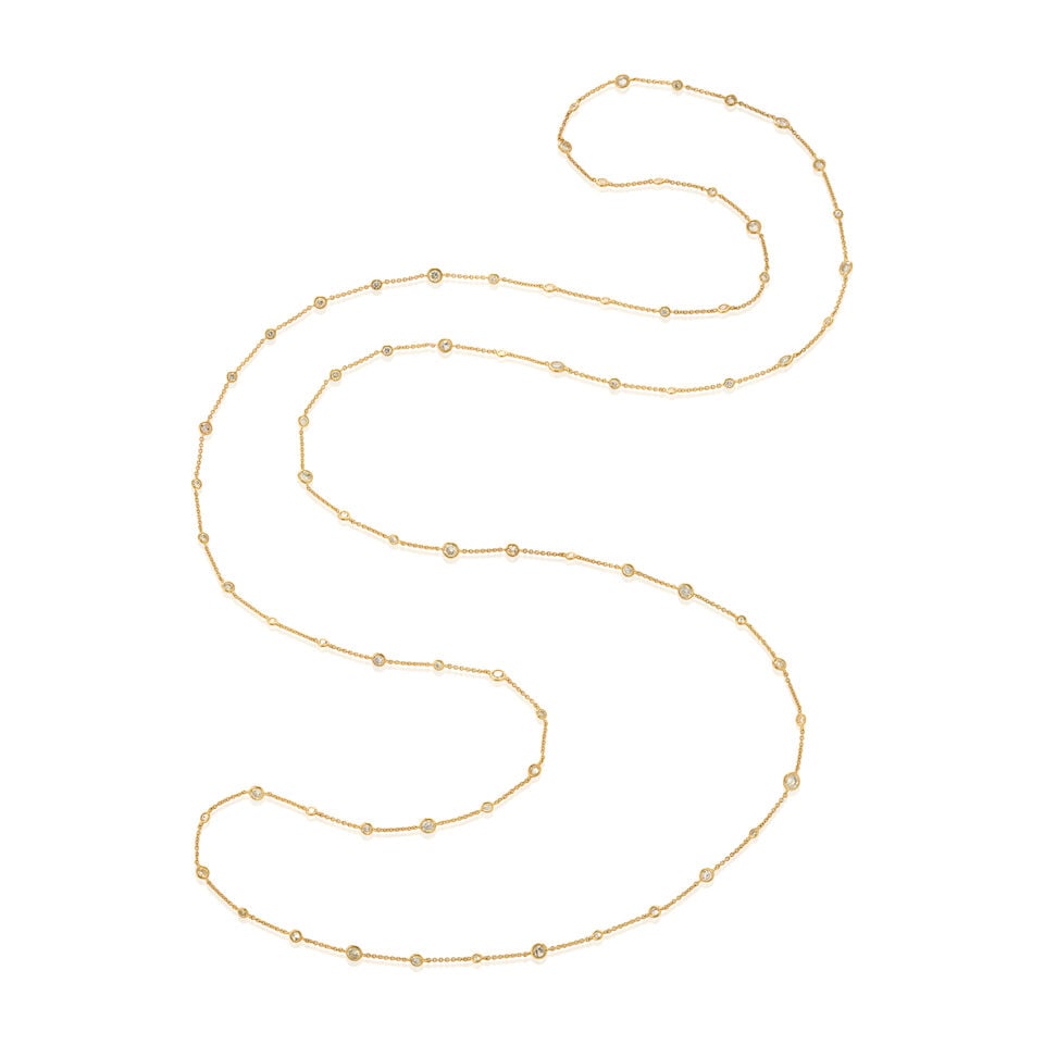 A 14K GOLD AND DIAMOND NECKLACE: A 14K GOLD AND DIAMOND NECKLACE With bezel-set full-cut diamonds, total weight 14.60 carats, weight 10.0 dwt, length 61 in. For further information on this lot please visit Bonhams.com For further inf