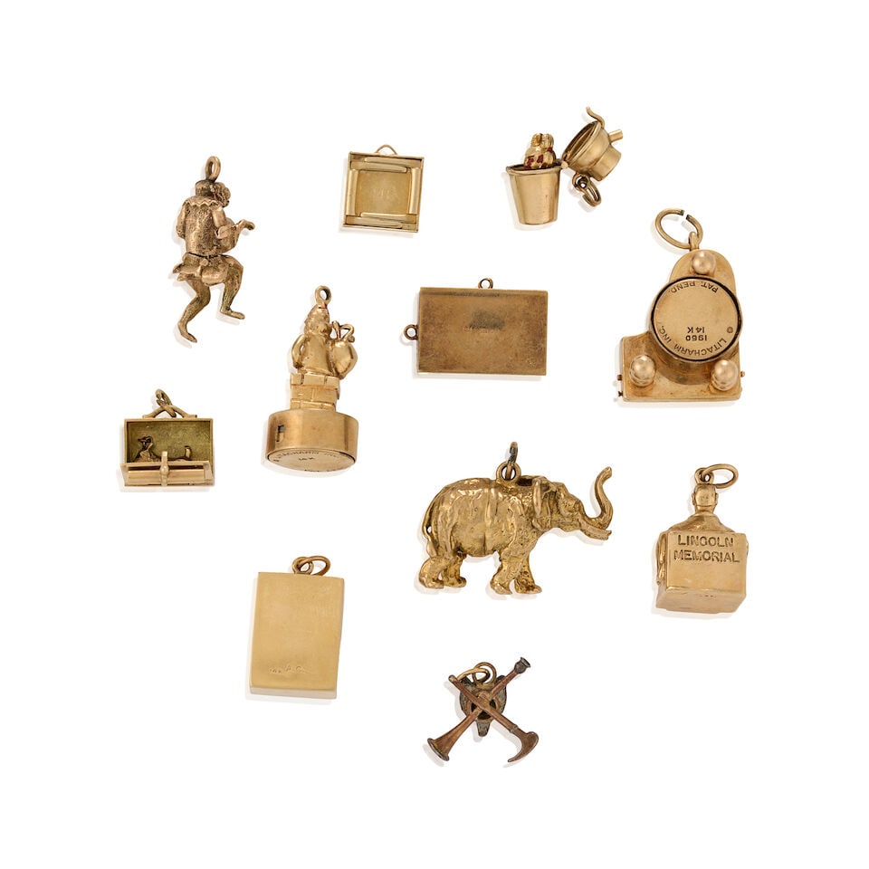 A GROUP OF MOSTLY 14K GOLD CHARMS - 2
