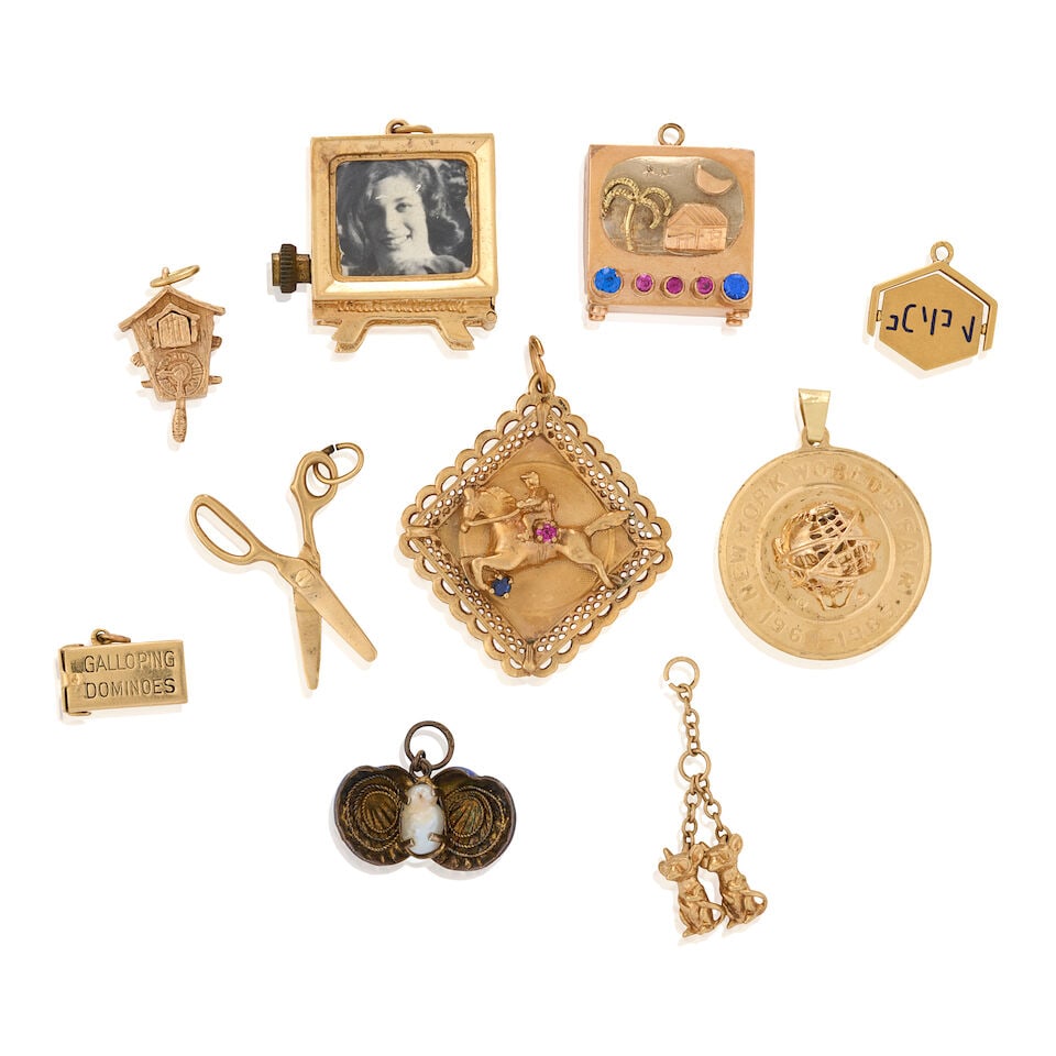 A GROUP OF MOSTLY 14K GOLD CHARMS (1 of 2)