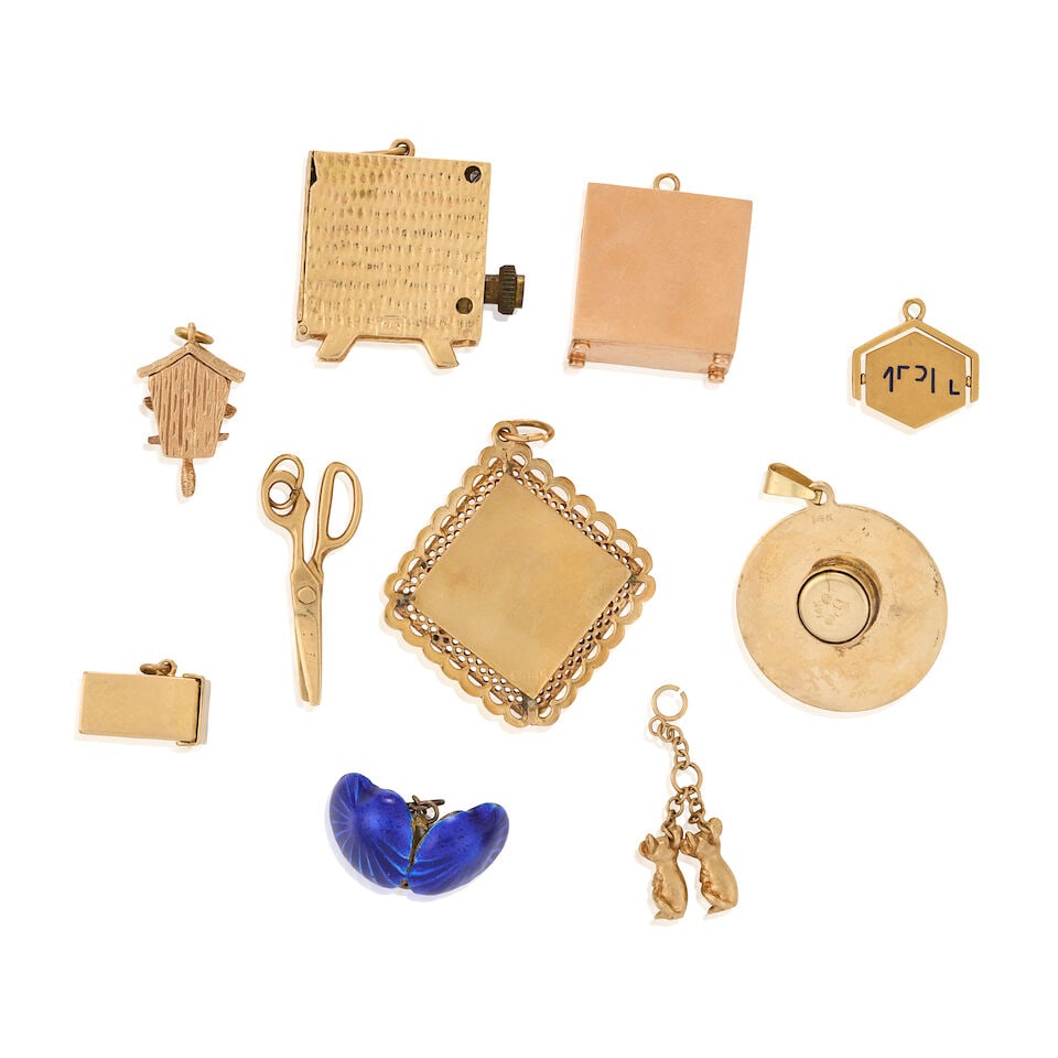 A GROUP OF MOSTLY 14K GOLD CHARMS - 2