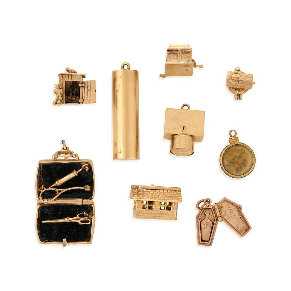 A GROUP OF MOSTLY 14K GOLD CHARMS - 2