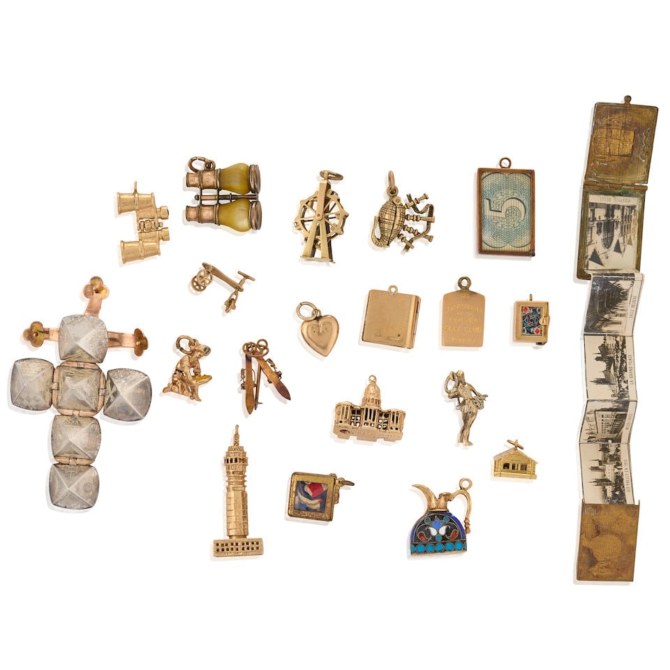 A GROUP OF MOSTLY GOLD CHARMS - 2