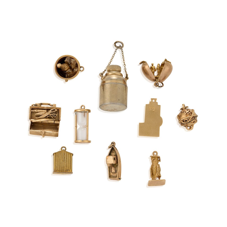 A GROUP OF GOLD CHARMS - 2