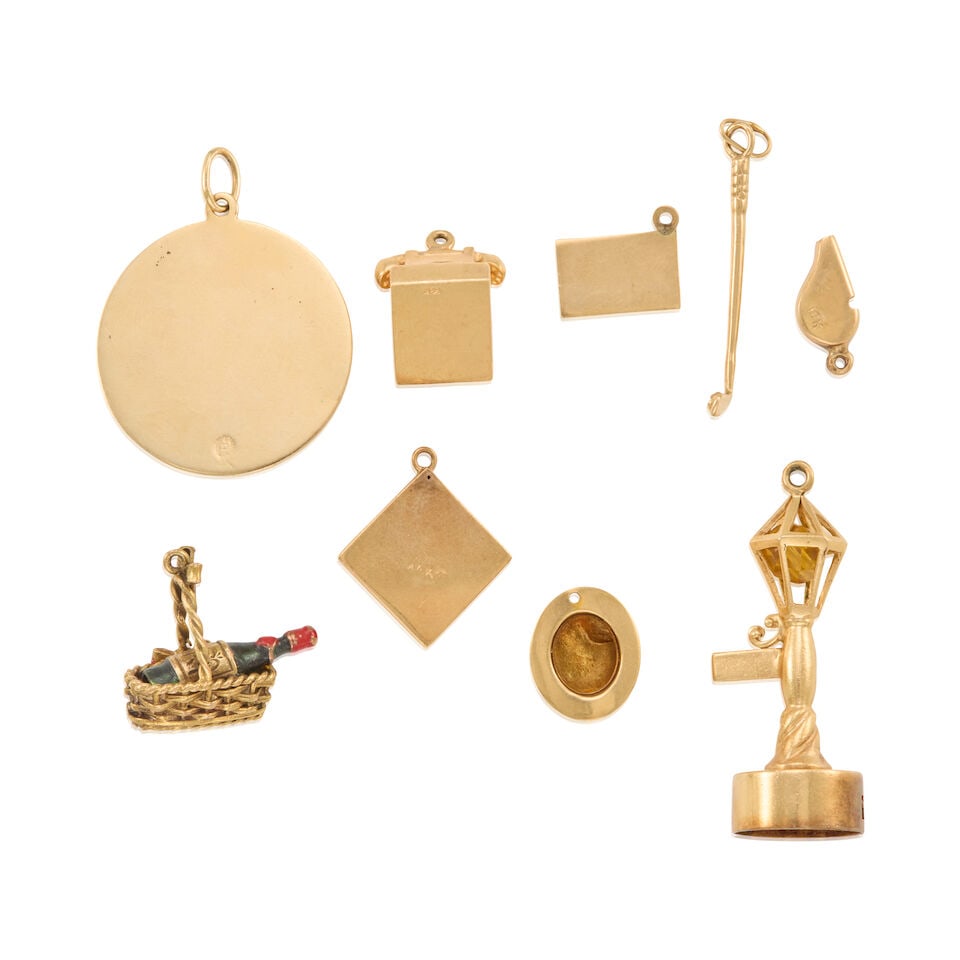 A GROUP OF GOLD CHARMS - 2