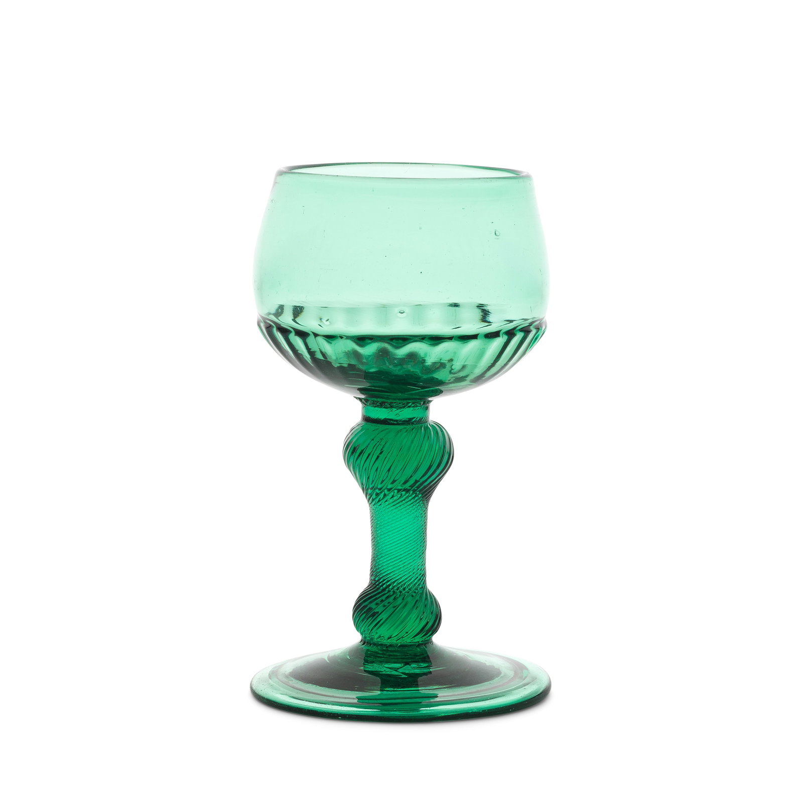 A green tinted incised twist baluster wine or champagne glass, circa 1750-60: A green tinted incised twist baluster wine or champagne glass, circa 1750-60 In green glass, the distinctive cup-shaped bowl moulded with a band of gadroons to the lower part, set on an incised twist 