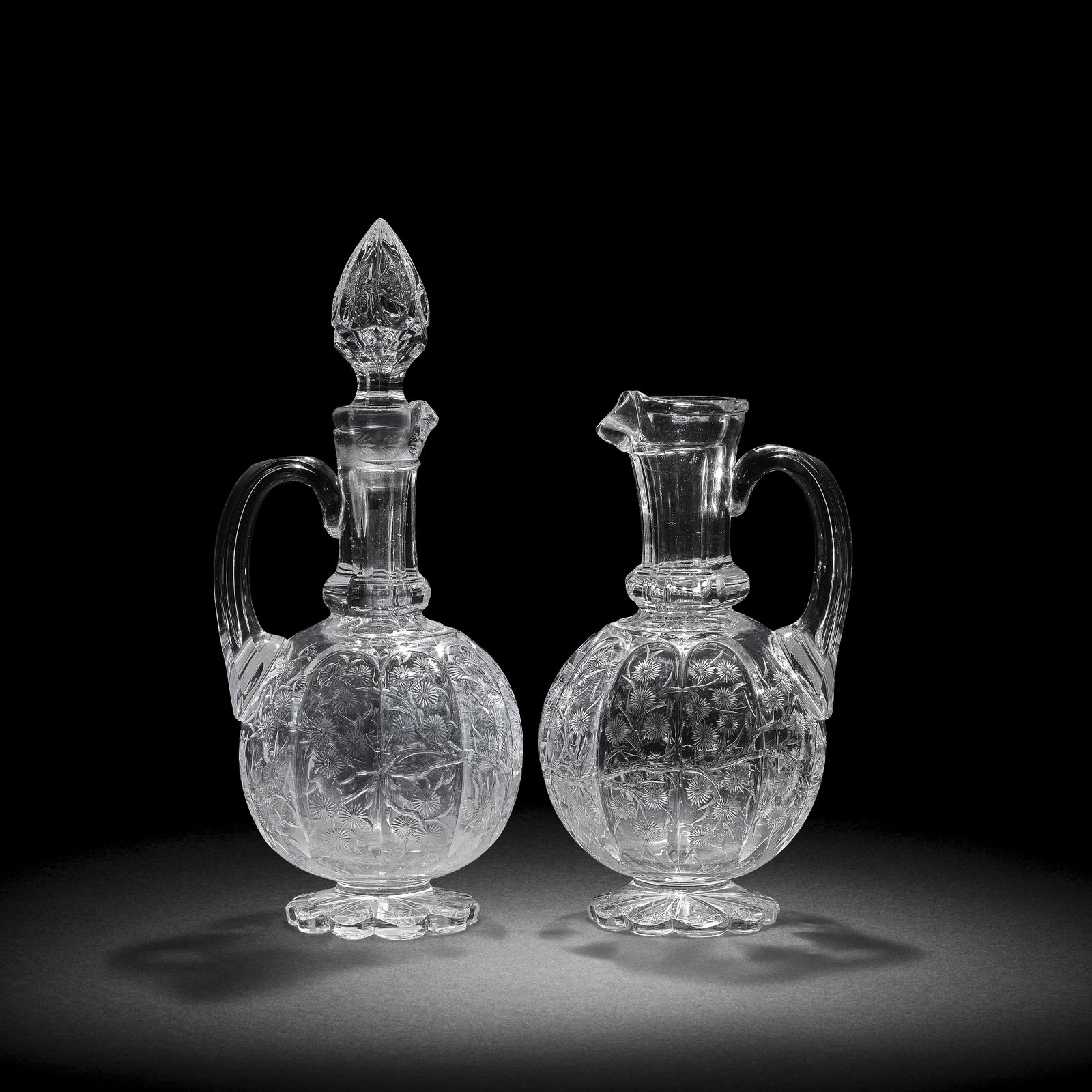 A Stevens and Williams 'rock crystal' ewer and a spirit decanter and stopper attributed to John ... (1 of 1)