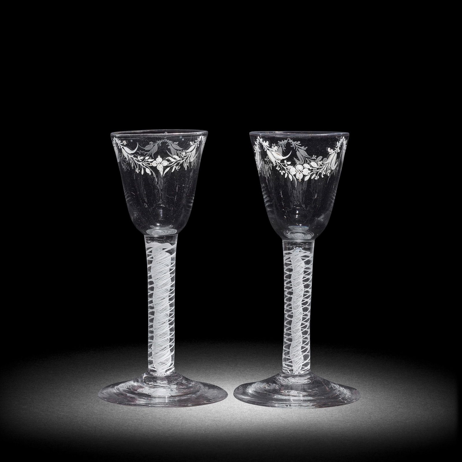 A matched pair of Beilby enamelled opaque twist wine glasses, circa 1765 (1 of 1)