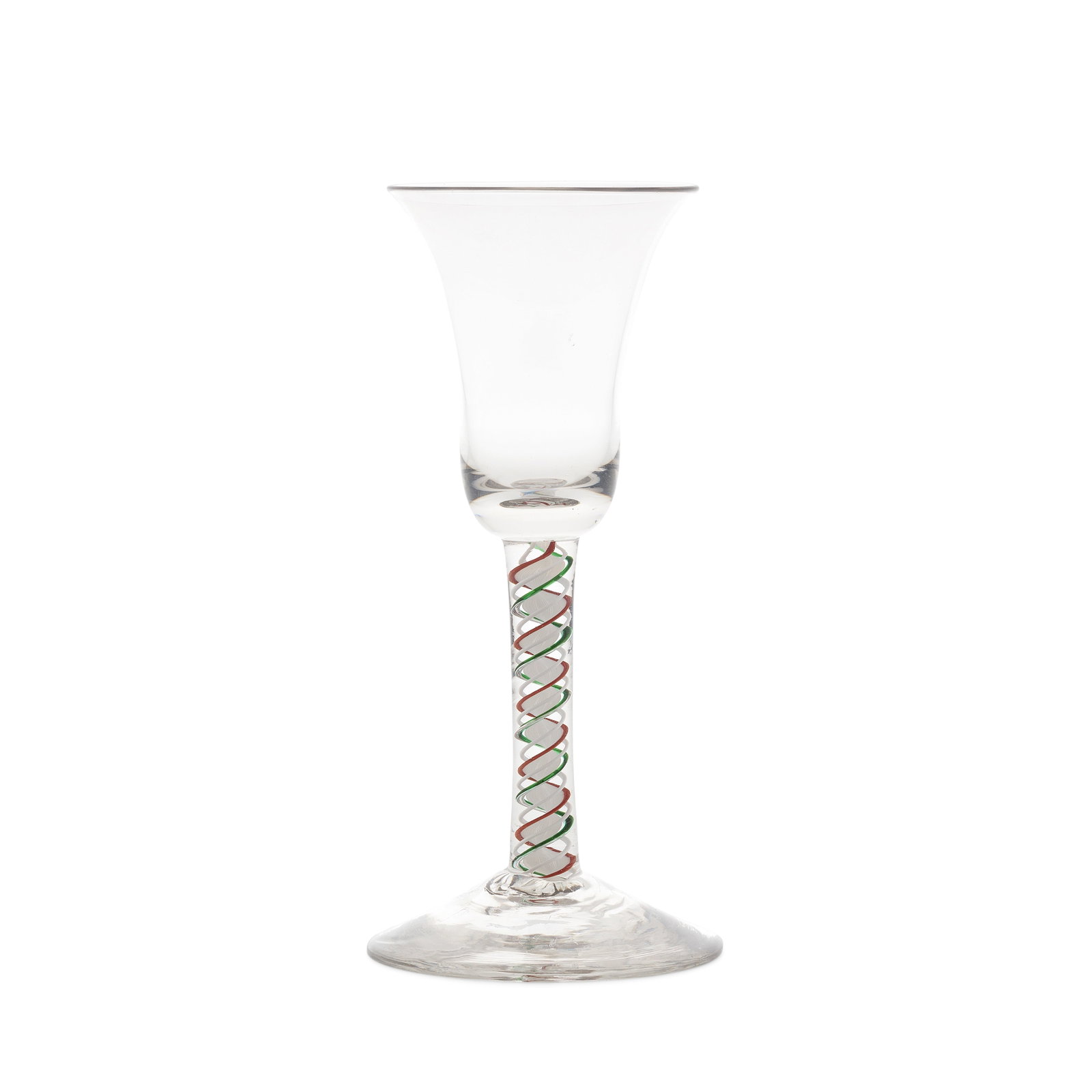 A red and green colour twist wine glass, circa 1765: A red and green colour twist wine glass, circa 1765 The bell bowl with a solid base, on a stem containing a solid opaque white multi-ply corkscrew edged on one side in translucent emerald-green and on