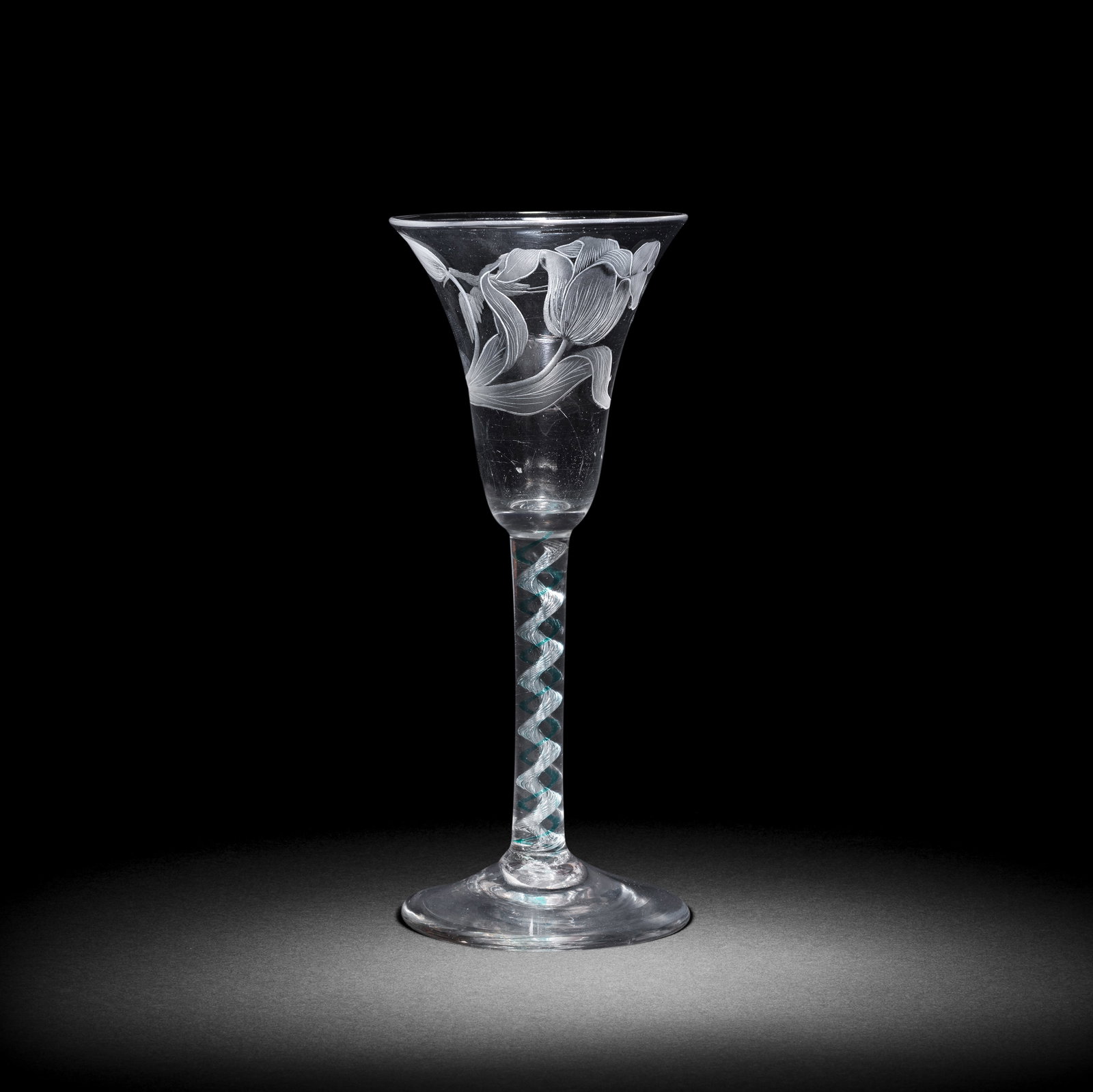 A fine engraved green mixed colour twist wine glass, circa 1765 (1 of 1)