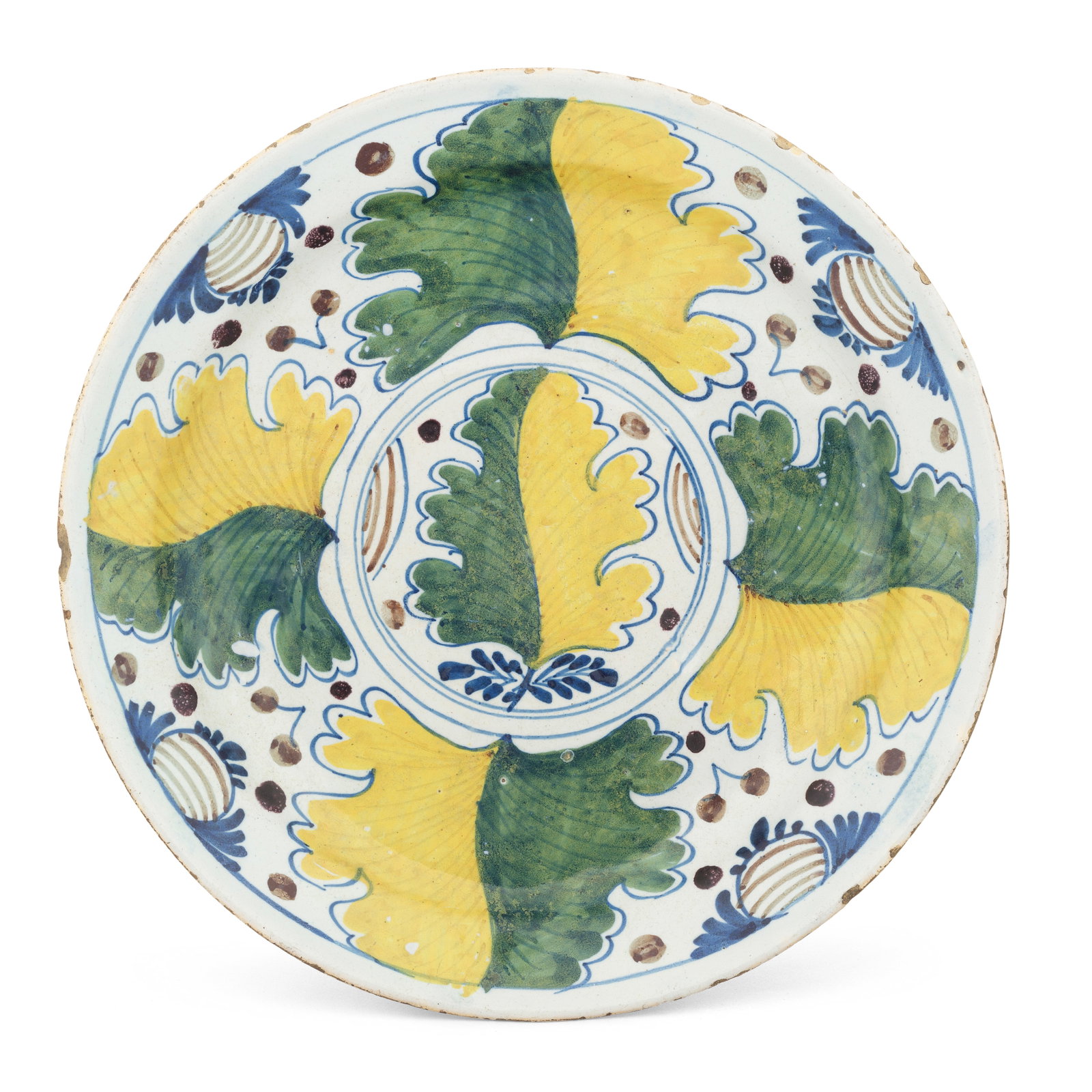 A Bristol Delftware 'Oak Leaf' dish, circa 1720-30: A Bristol Delftware 'Oak Leaf' dish, circa 1720-30 Painted in green, yellow, blue and reddish-brown with variegated oak leaves amongst stylised berries, the wide footrim pierced in multiple places for
