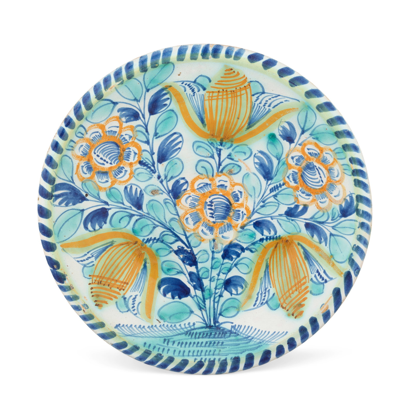 An early London delftware rose and tulip charger, circa 1660-80: An early London delftware rose and tulip charger, circa 1660-80 Possibly Rotherhithe, painted in ochre, blue and green, with a formal rose bush with three large stylised flowerheads and three open tul