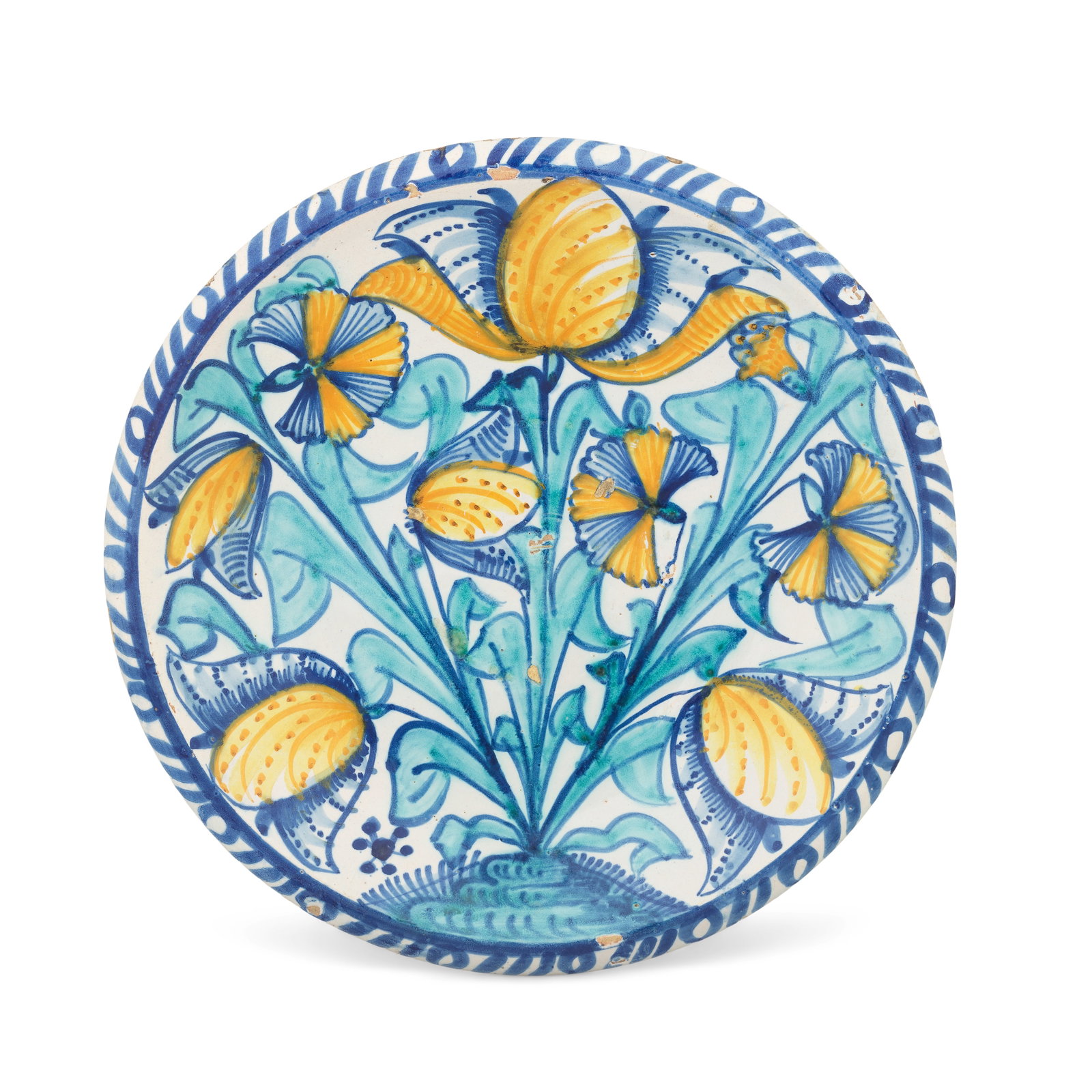 An English delftware tulip charger, circa 1680-90: An English delftware tulip charger, circa 1680-90 Probably London, fully painted in blue, turquoise and yellow with tulips, carnations and other flowers, the tips of the tall leaves dipping to fill th