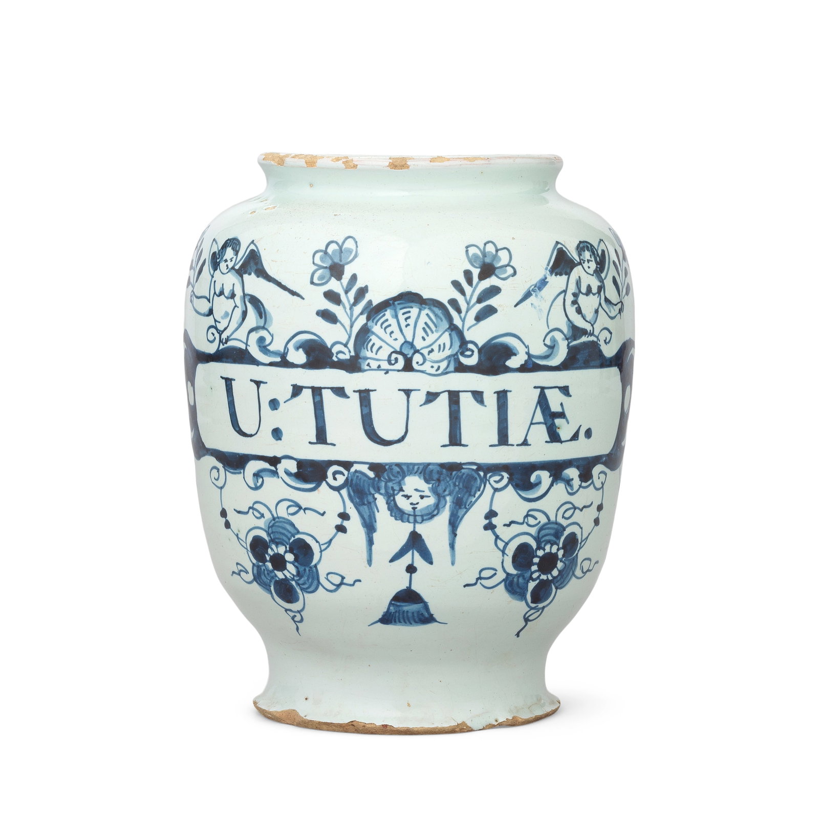 An English delftware drug jar, circa 1740: An English delftware drug jar, circa 1740 Of ovoid shape, painted in blue with a scrollwork label inscribed 'U:TUTIAE', a shell flanked by cherubs bearing floral sprigs, a winged angel head between st