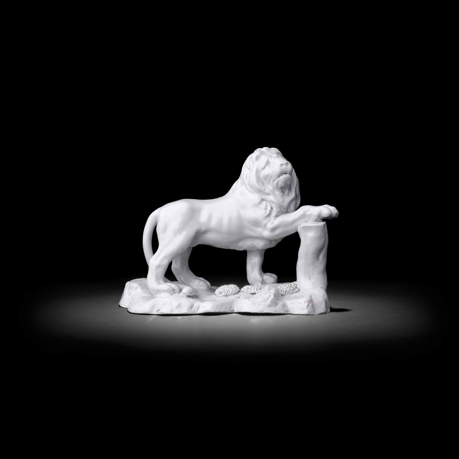 An impressive Bow model of a lion, circa 1750-52: An impressive Bow model of a lion, circa 1750-52 Of large stature, modelled standing on an irregular, rocky base with his front right paw resting upon a woody stump, his expressive face turned to the 