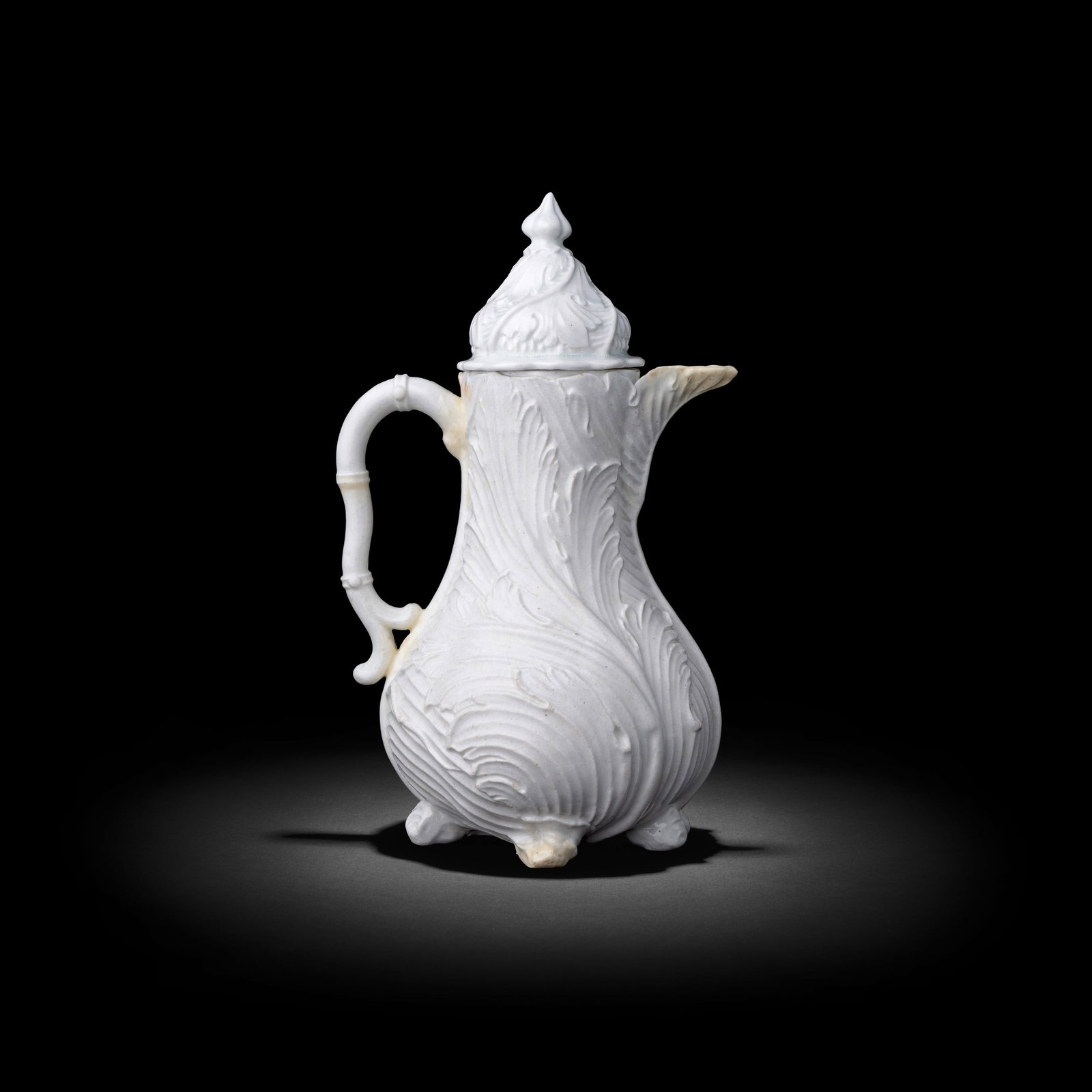 An exceptionally rare Chelsea white acanthus or 'Strawberry Leaf' coffee pot and cover, circa 17...: An exceptionally rare Chelsea white acanthus or 'Strawberry Leaf' coffee pot and cover, circa 1745-49 Of baluster shape, crisply moulded overlapping acanthus leaves swirling around the body, the handl