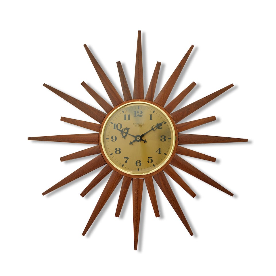 A teak sunburst clock Season 7, Episode 7, 'A Practical Guide for Time-Travelers', for the Carav... (1 of 1)