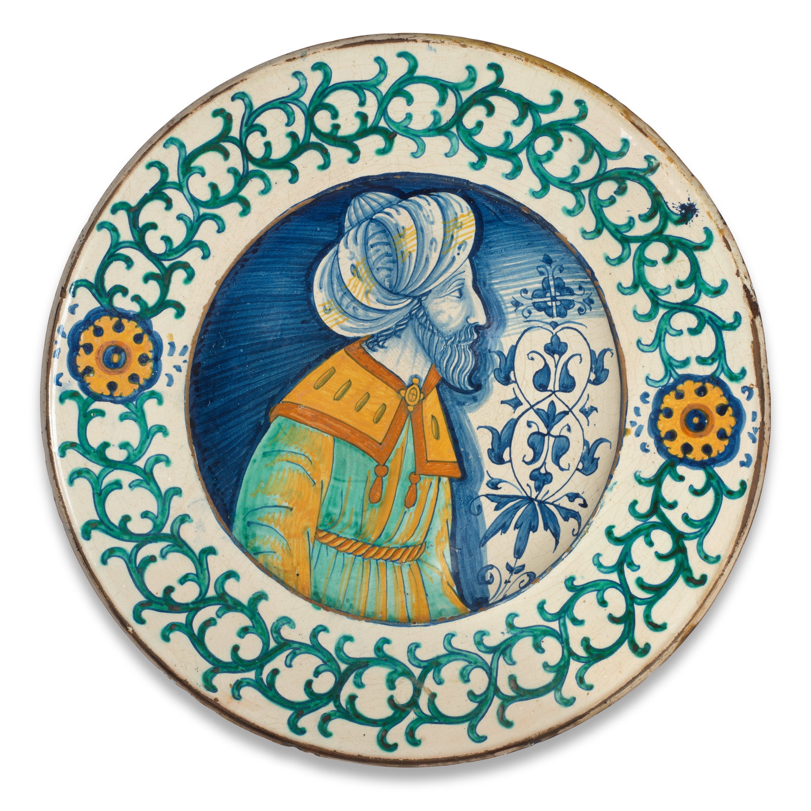 A Deruta maiolica dish painted with a Turkish sultan, first third 16th century: A Deruta maiolica dish painted with a Turkish sultan, first third 16th century Painted in the well in shades of blue, ochre and green with a profile bust of an Ottoman sultan, possibly depicting Mehme