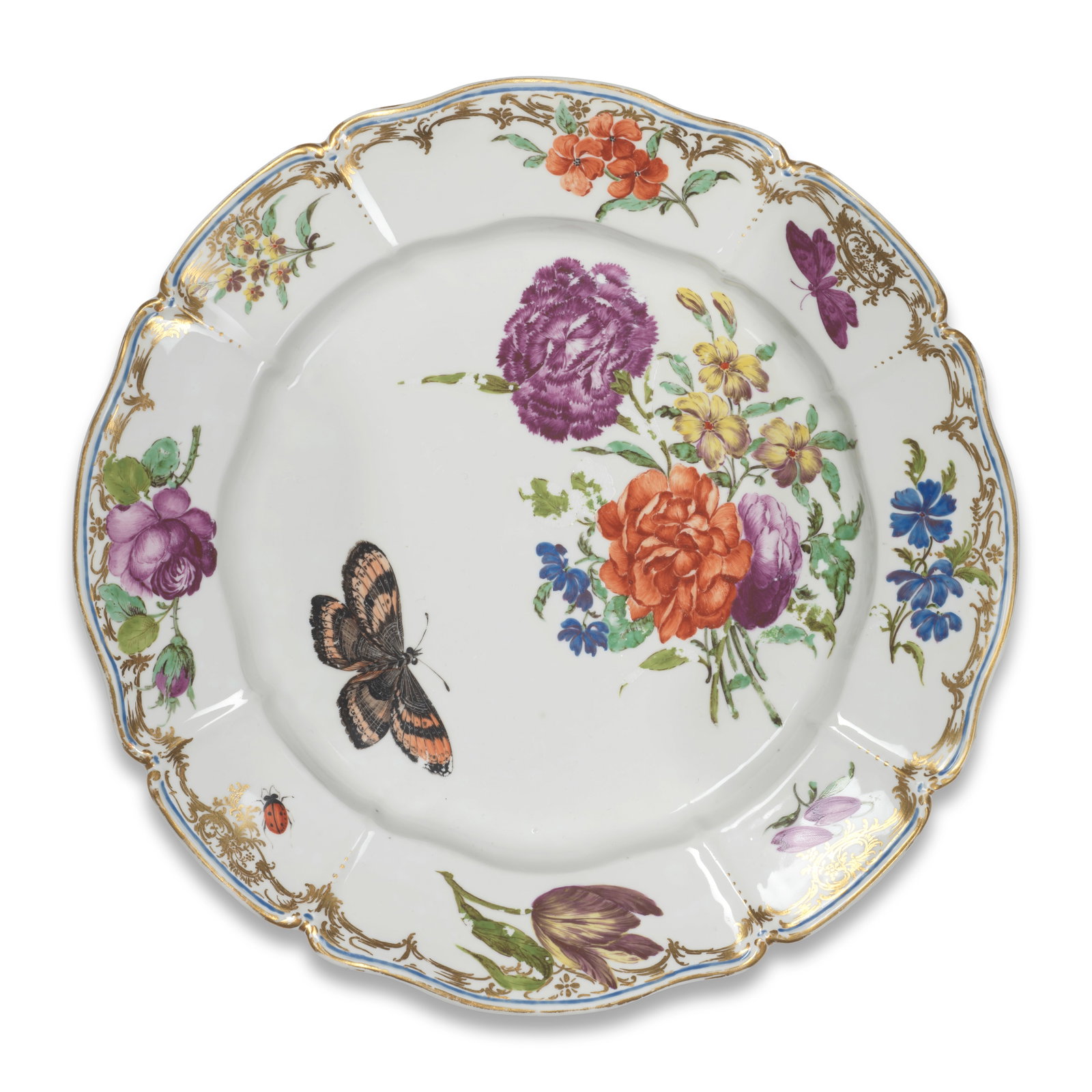 A Nymphenburg plate from the 'Hofservice', circa 1760-65: A Nymphenburg plate from the 'Hofservice', circa 1760-65 Probably painted by J. Zächenberger, with a large flower spray, a butterfly and detailed butterfly in the well, the lobed rim with flower 