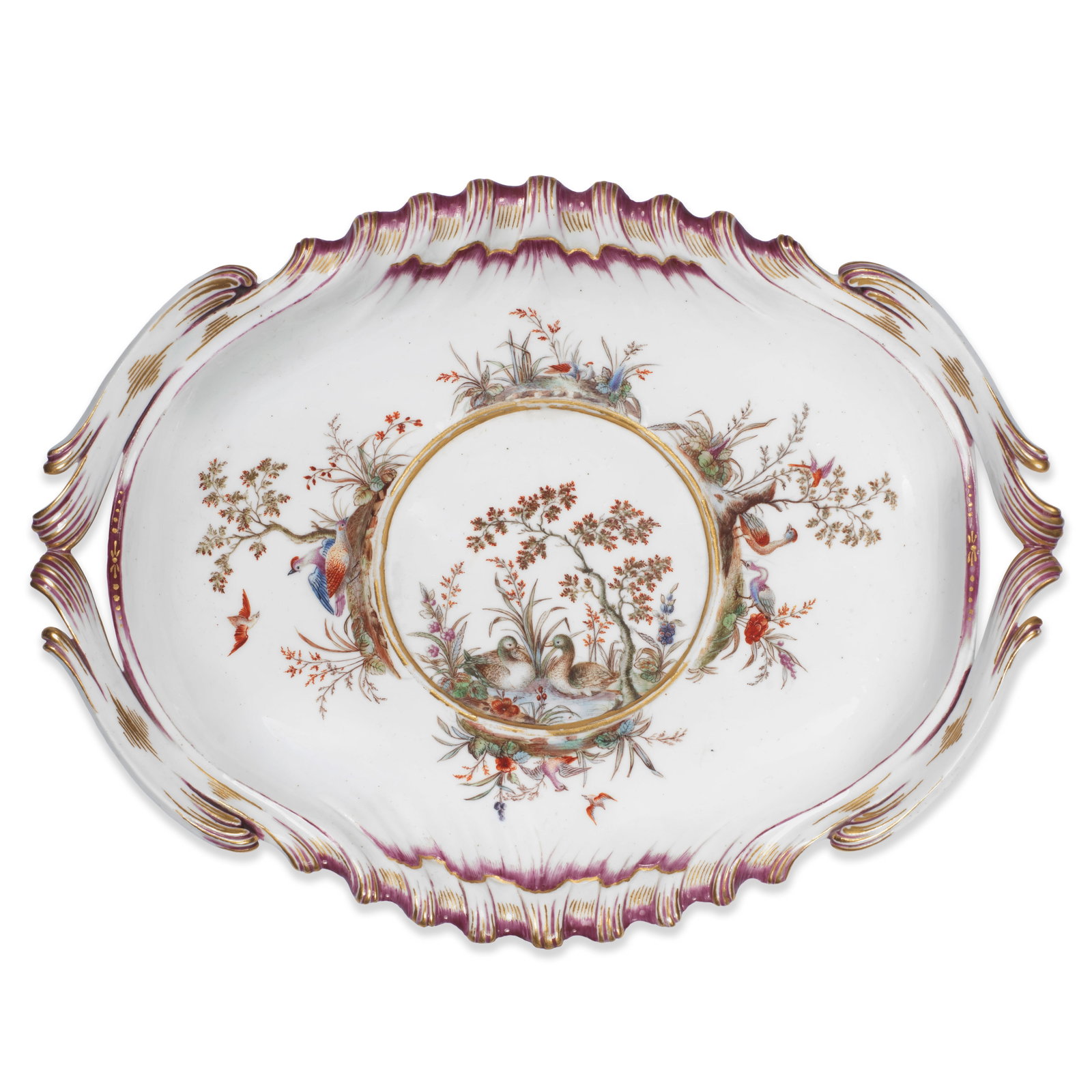 A rare Vincennes oval ecuelle stand, circa 1748-52: A rare Vincennes oval ecuelle stand, circa 1748-52 Of shaped oval form, shell-moulded at the top and bottom and with scroll handles to the sides, all embellished in purple and gilding, decorated with 