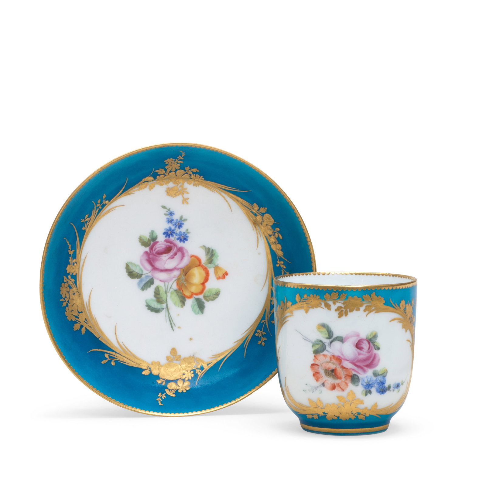 A Vincennes bleu céleste-ground cup and saucer (gobelet Calabre et soucoupe), circa 1754: A Vincennes bleu céleste-ground cup and saucer (gobelet Calabre et soucoupe), circa 1754 Of the second size, each with a flower sprig in a reserve edged with gilt foliage and flowers, gilt dentil