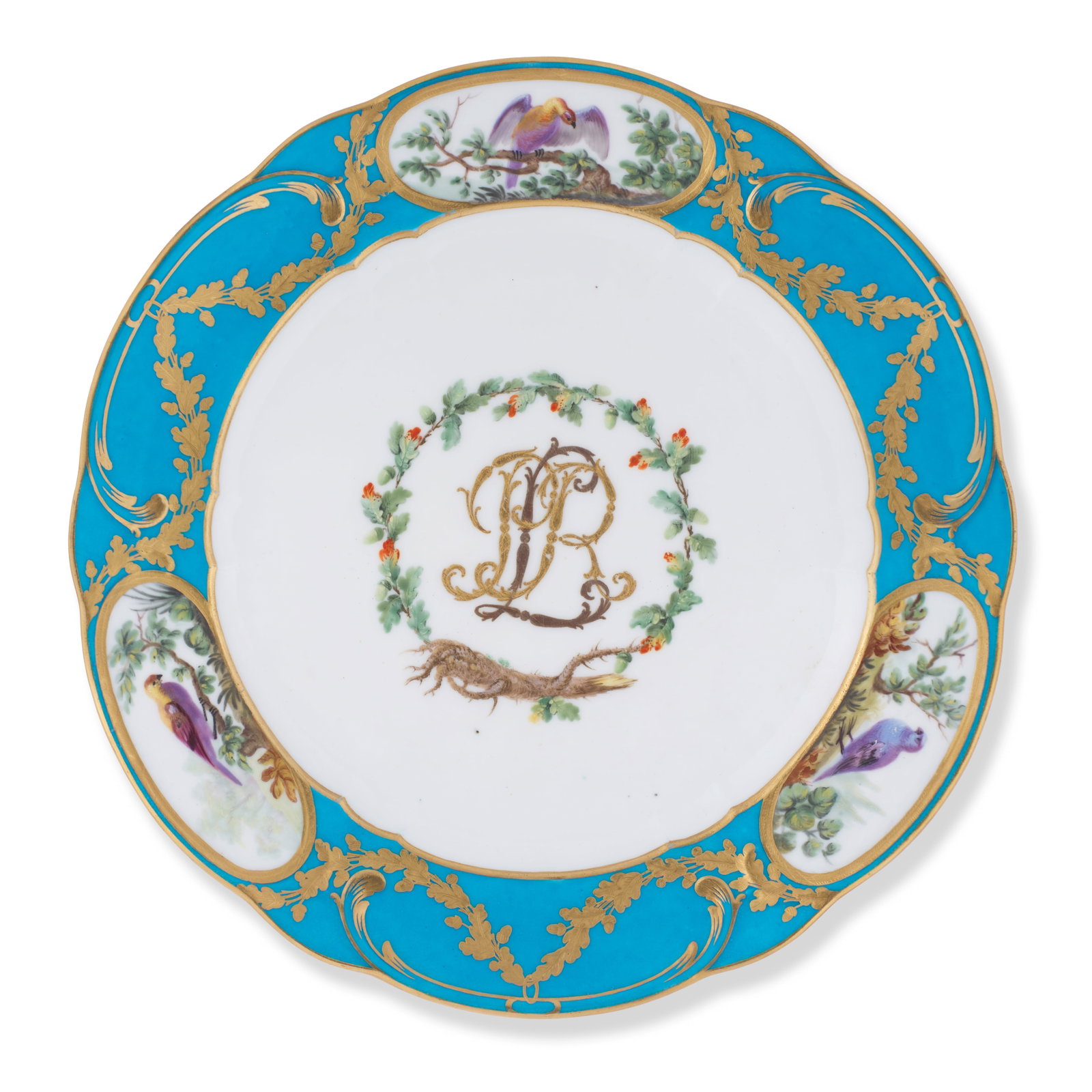 A Sèvres bleu céleste-ground plate from the Prince de Rohan Service, circa 1771: A Sèvres bleu céleste-ground plate from the Prince de Rohan Service, circa 1771 Decorated in the centre of the well with the monogram 'LPR' in two tones of gilding surrounded by an oak leaf 