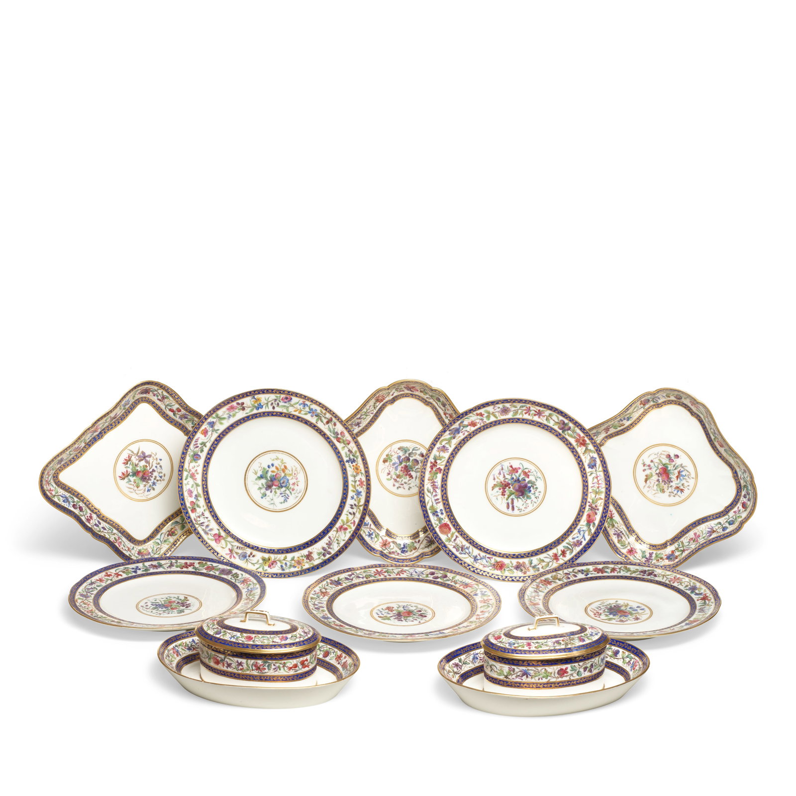 A Sèvres part service, circa 1793: A Sèvres part service, circa 1793 Painted in polychrome enamels shaded in gilding in the style of enamelling or cloisonné, the centre with a group of flowers within two gilt circles, the rim