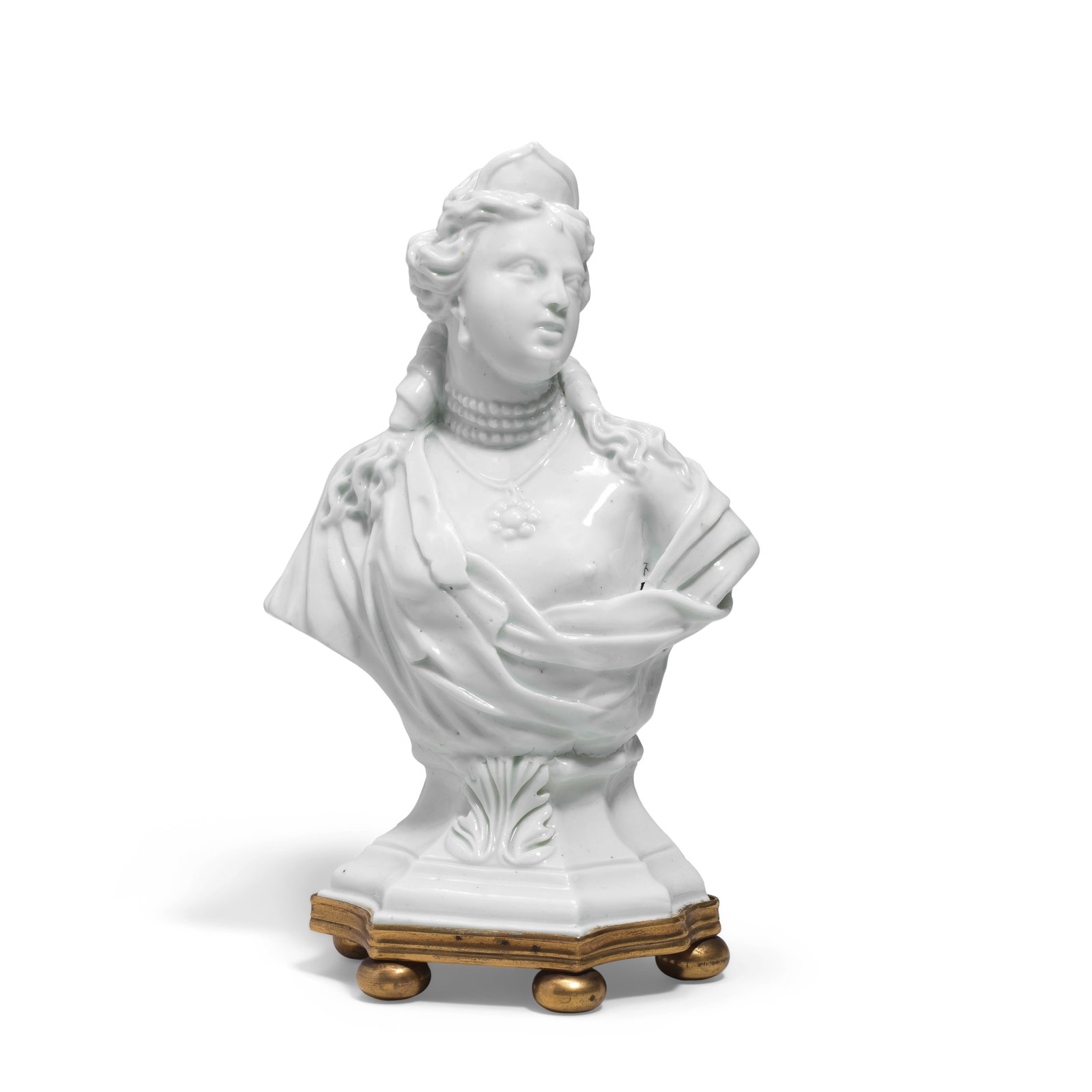 A very rare bust of Venus, probably Tournai, circa 1750-60: A very rare bust of Venus, probably Tournai, circa 1750-60 Mounted on a gilt bronze base, wearing Classical drapery and a triple strand of pearls around her neck, 18.3cm high Footnotes: Provenance: Jo