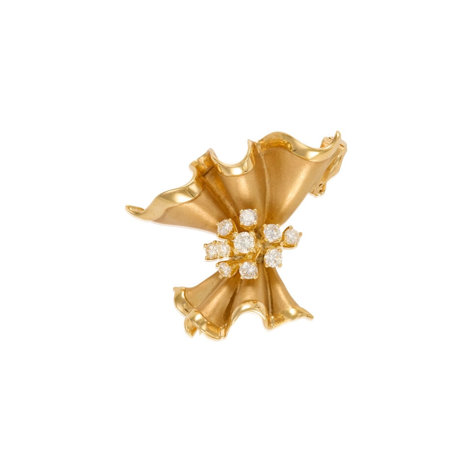 AN 18K YELLOW GOLD AND DIAMOND BROOCH: AN 18K YELLOW GOLD AND DIAMOND BROOCH • Ten round brilliant cut diamonds weighing approximately 0.45 carat total • Measures 1 1/4 in. x 1 1/2 in. • Estimated gross weight: 15.5