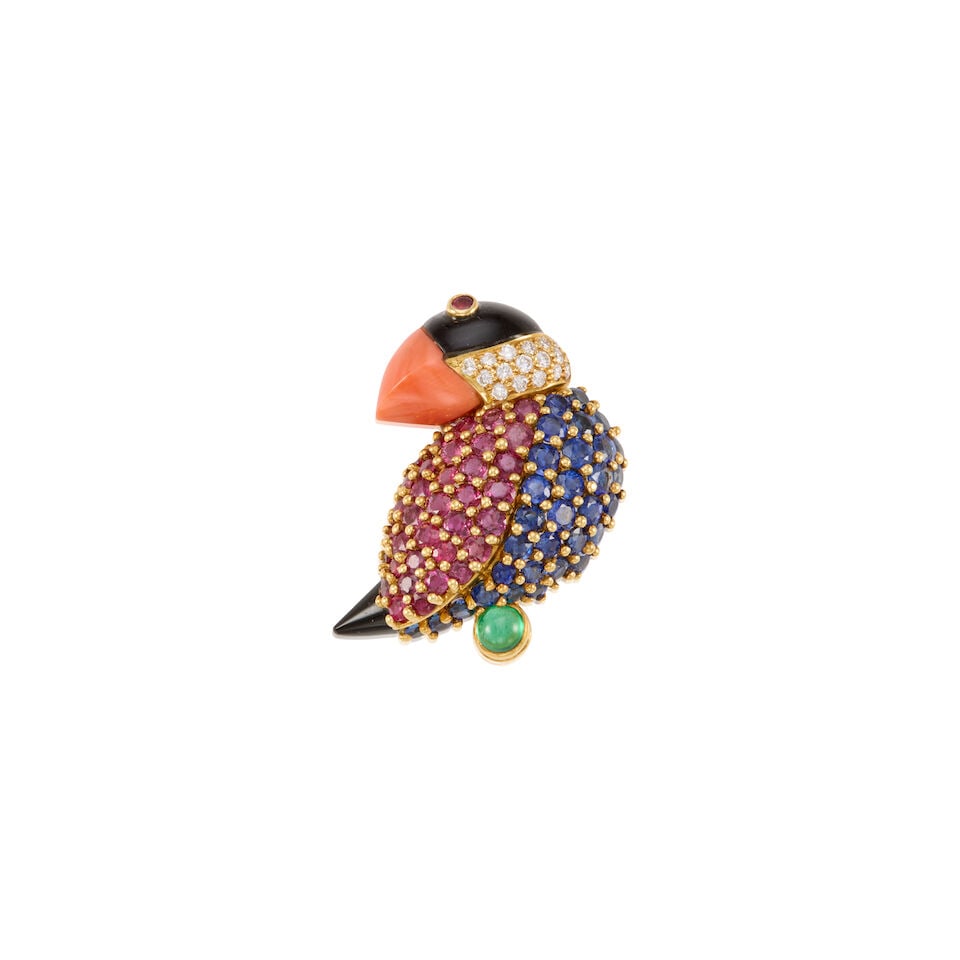 JEAN VITAU: AN 18K YELLOW GOLD AND GEM-SET BROOCH: JEAN VITAU: AN 18K YELLOW GOLD AND GEM-SET BROOCH • Numerous round rubies measuring approximately 2.70mm in diameter • Numerous round shaped sapphires measuring approximately 2.60mm in