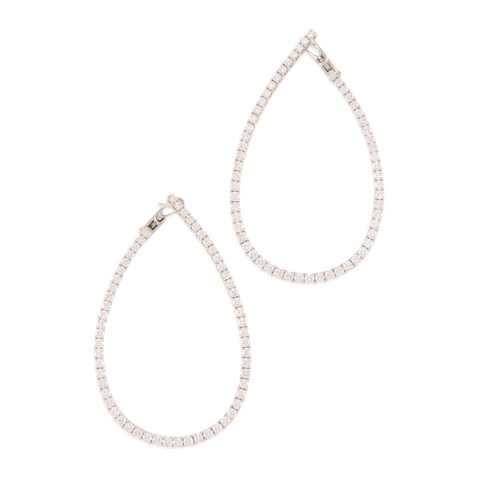 A PAIR OF 18K WHITE GOLD AND DIAMOND HOOP EARRINGS: A PAIR OF 18K WHITE GOLD AND DIAMOND HOOP EARRINGS • Numerous round shaped diamonds weighing approximately 2.30 carats total • Measures 2 3/16 in. x 1 3/8 in. • Estimated gross