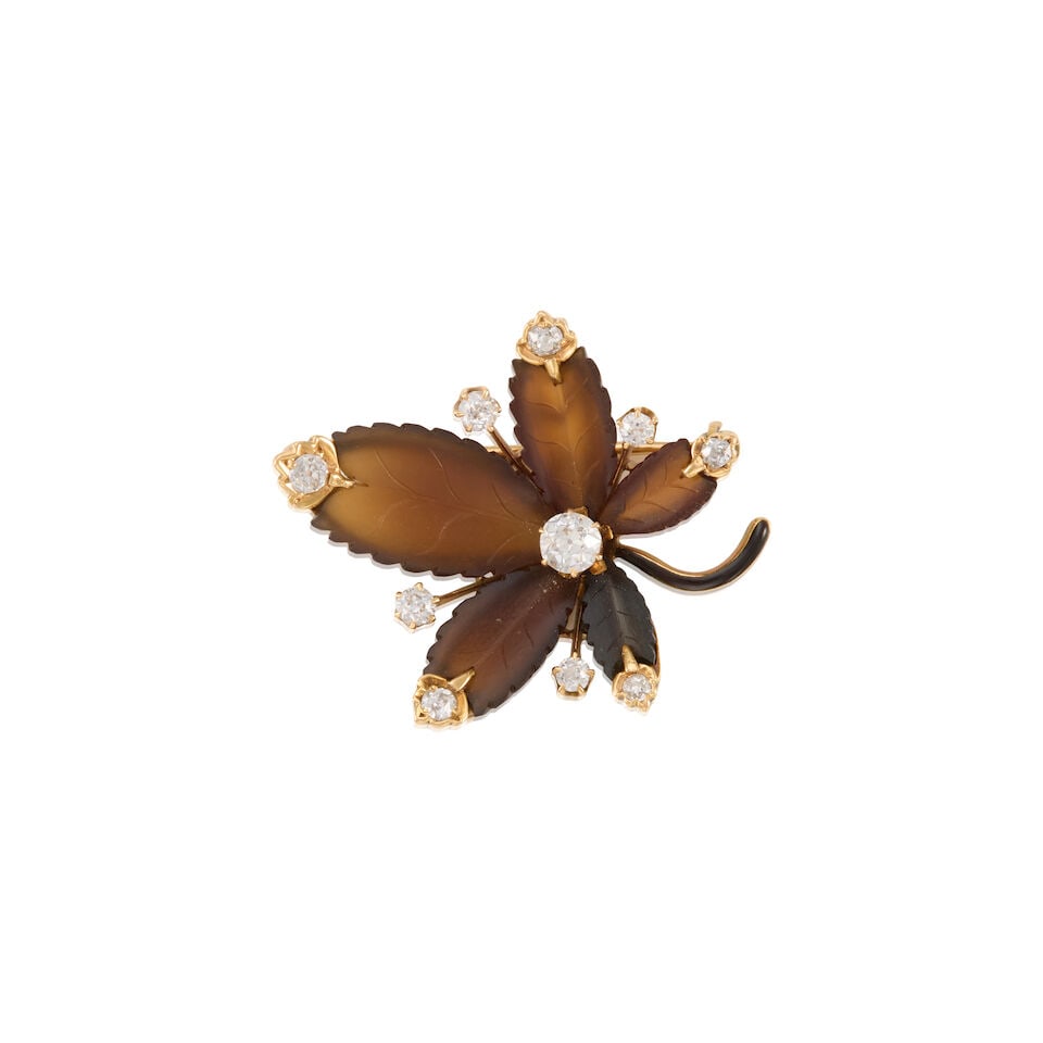 AN ANTIQUE 14K YELLOW GOLD, AGATE AND DIAMOND BROOCH: AN ANTIQUE 14K YELLOW GOLD, AGATE AND DIAMOND BROOCH • Ten old European cut diamonds weighing approximately 0.60 carats total • Five carved agate pieces measuring approximately 7.75mm x