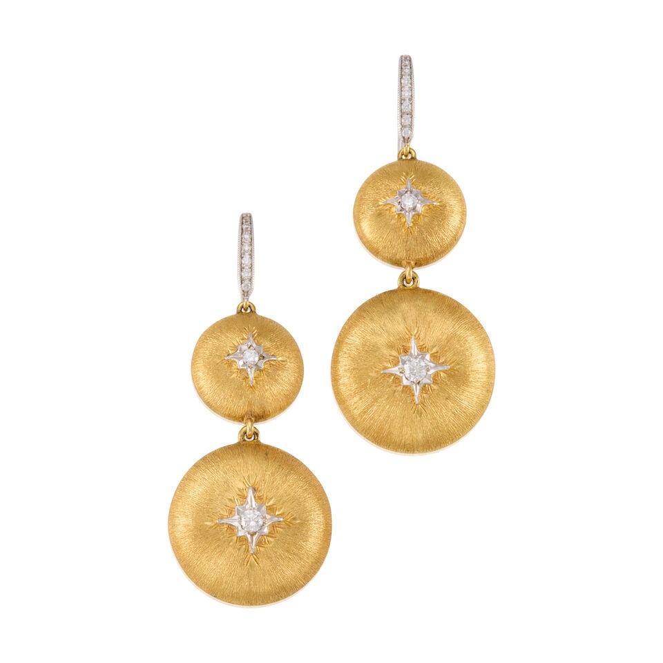 A PAIR OF BI-COLOR GOLD AND DIAMOND EARRINGS: A PAIR OF BI-COLOR GOLD AND DIAMOND EARRINGS • 16K and 18K yellow and white gold • Numerous round shaped diamonds weighing approximately 0.50 carat total • Measures 1 7/8 in. x 3/4