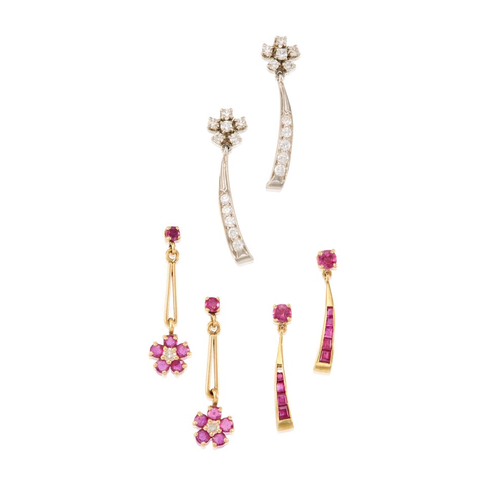 THREE PAIRS OF RUBY AND DIAMOND EARRINGS: THREE PAIRS OF RUBY AND DIAMOND EARRINGS • Pair of platinum earrings with numerous round shaped diamonds weighing approximately 0.44 carat total, measures 1 3/16 in. x 5/16 in. • Pair of