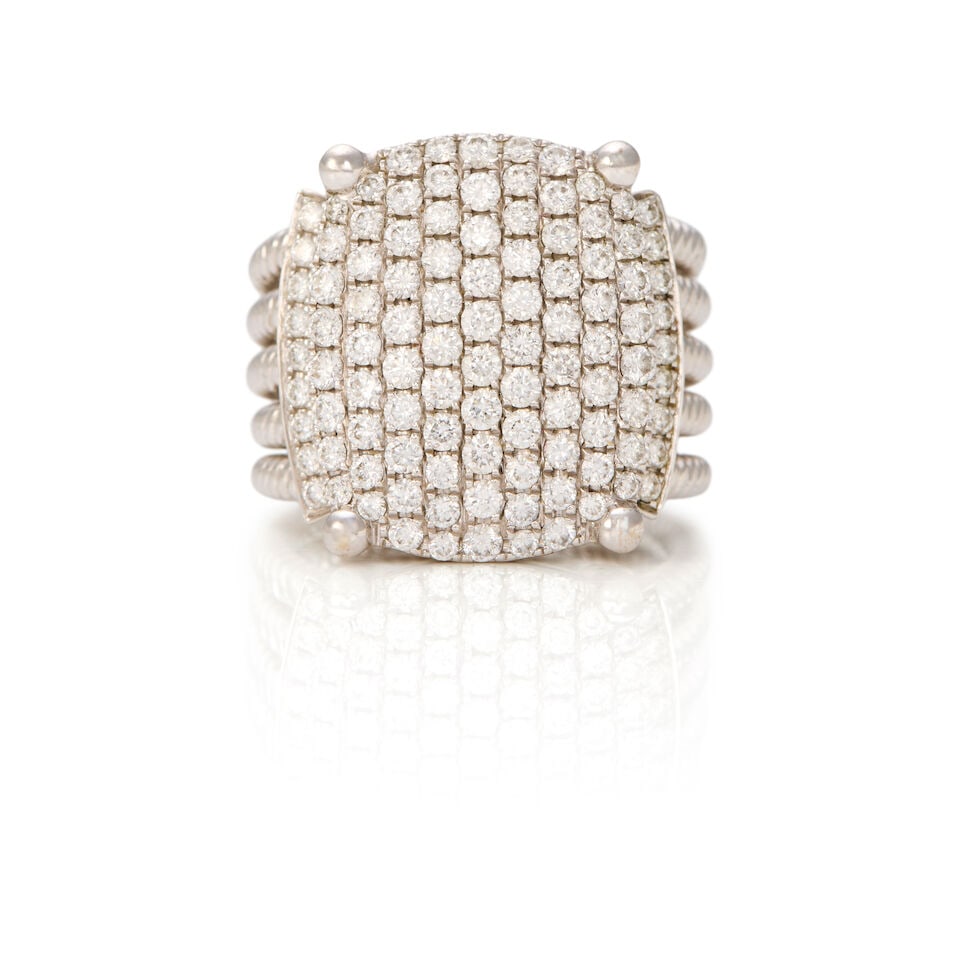AN 18K WHITE GOLD AND DIAMOND RING: AN 18K WHITE GOLD AND DIAMOND RING • Numerous round shaped diamonds weighing approximately 2 carats total • Size 6 1/2 • Estimated gross weight: 15.0 grams Footnotes: OVERALL
