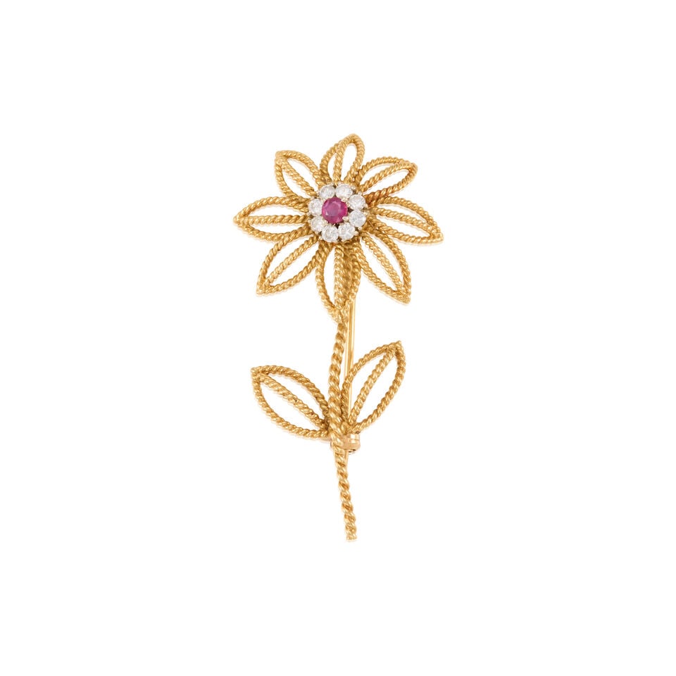 TIFFANY & CO.: 18K YELLOW GOLD, RUBY, AND DIAMOND BROOCH: TIFFANY & CO.: 18K YELLOW GOLD, RUBY, AND DIAMOND BROOCH • One round shaped ruby weighing approximately 0.10 carat • Eight round shaped diamonds weighing approximately 0.16 carat total