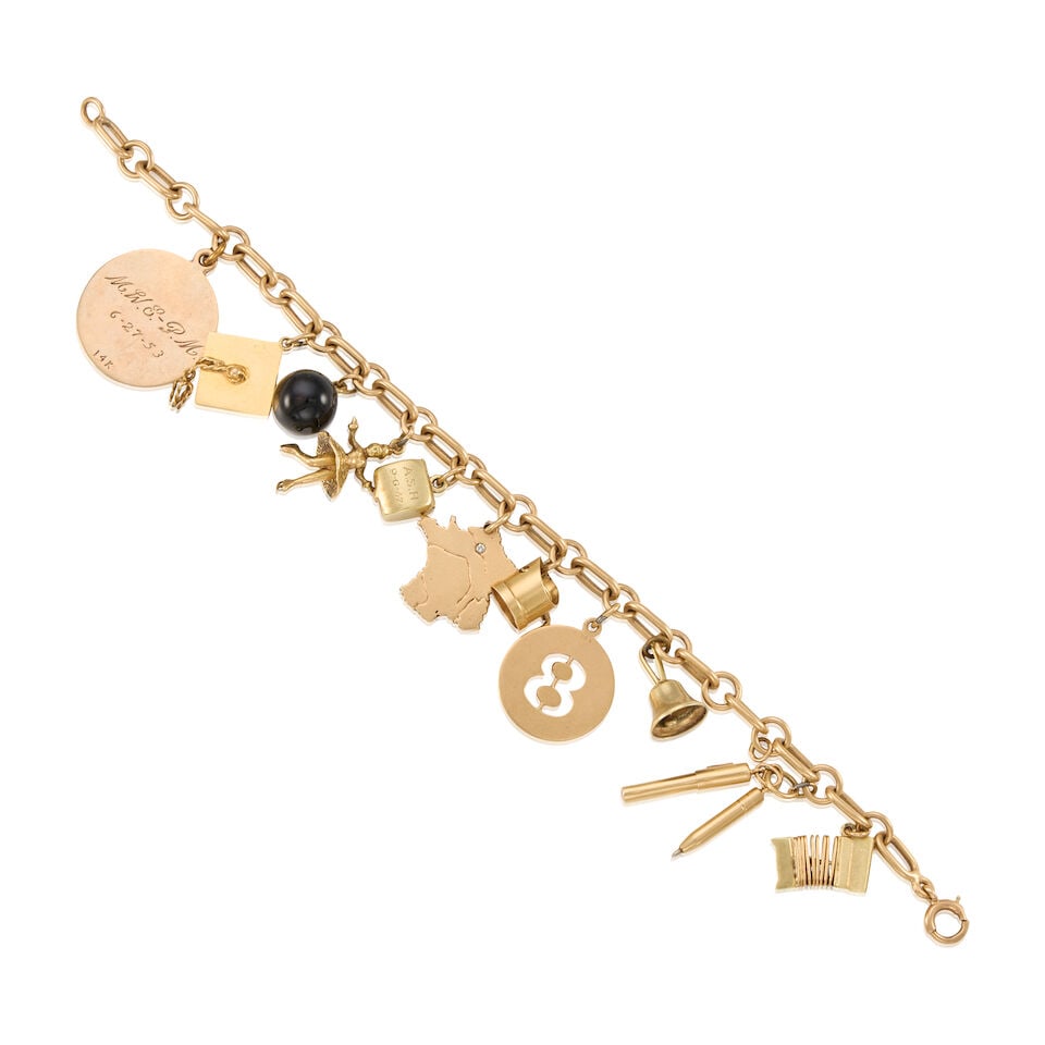A GOLD CHARM BRACELET: A GOLD CHARM BRACELET • A 14K yellow gold bracelet with 12 charms ranging from 9K to 16K yellow gold • Length 7 in. • Estimated gross weight: 32.3 grams Footnotes: OVERALL