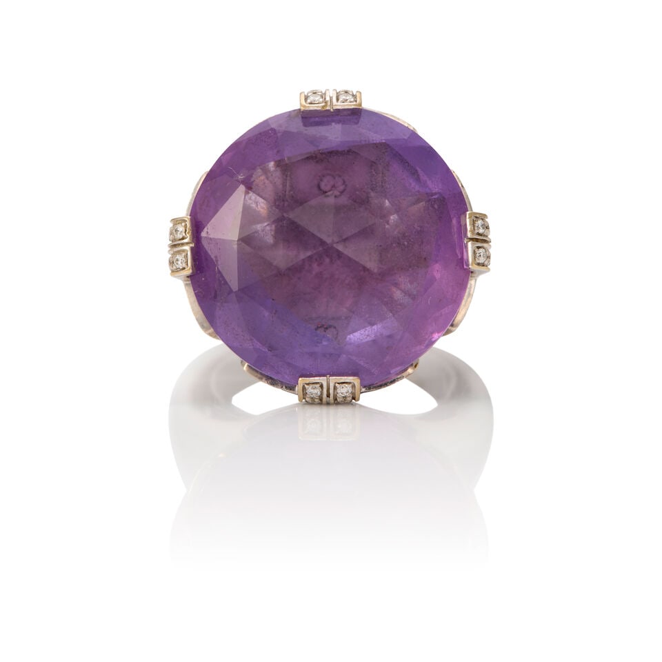 BULGARI: 18K WHITE GOLD, AMETHYST, AND DIAMOND PARENTESI RING: BULGARI: 18K WHITE GOLD, AMETHYST, AND DIAMOND PARENTESI RING • One round shaped amethyst measuring approximately 20.07mm in diameter • Numerous round shaped diamonds weighing
