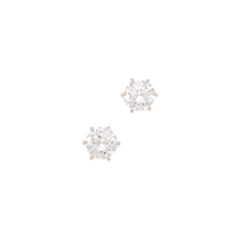 12K WHITE GOLD AND DIAMOND EARRINGS: 12K WHITE GOLD AND DIAMOND EARRINGS • Two round brilliant cut diamonds weighing approximately 1.50 carats total • Measures 7/16 in. x 5/16 in. • Estimated gross weight: 1.7