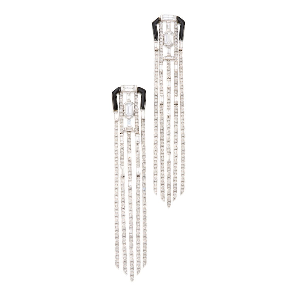 18K WHITE GOLD, DIAMOND, AND ONYX EARRINGS: 18K WHITE GOLD, DIAMOND, AND ONYX EARRINGS • Numerous rectangular shaped diamonds weighing approximately 0.70 carat total • Numerous round shaped diamonds weighing approximately 2 - 4