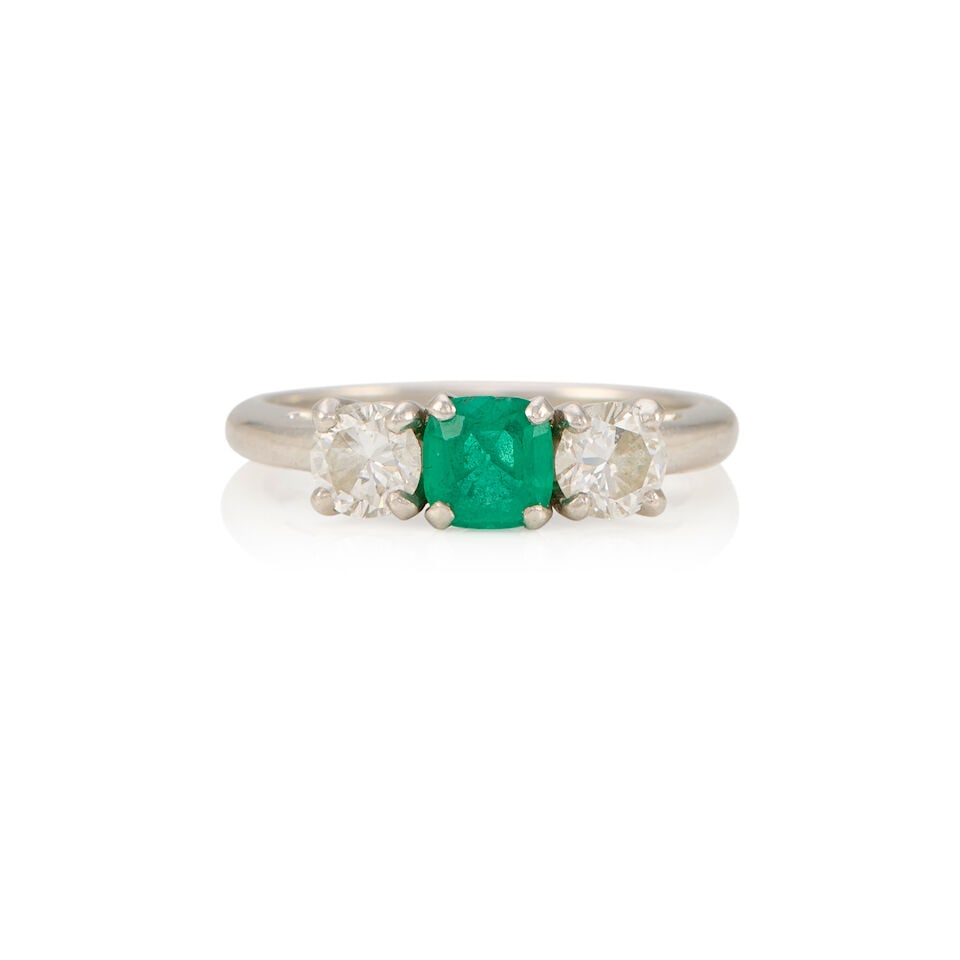 PLATINUM, EMERALD, AND DIAMOND RING: PLATINUM, EMERALD, AND DIAMOND RING • A square shaped emerald weighing approximately 0.30 carat total • Two round brilliant cut diamonds weighing approximately 0.50 carat total •
