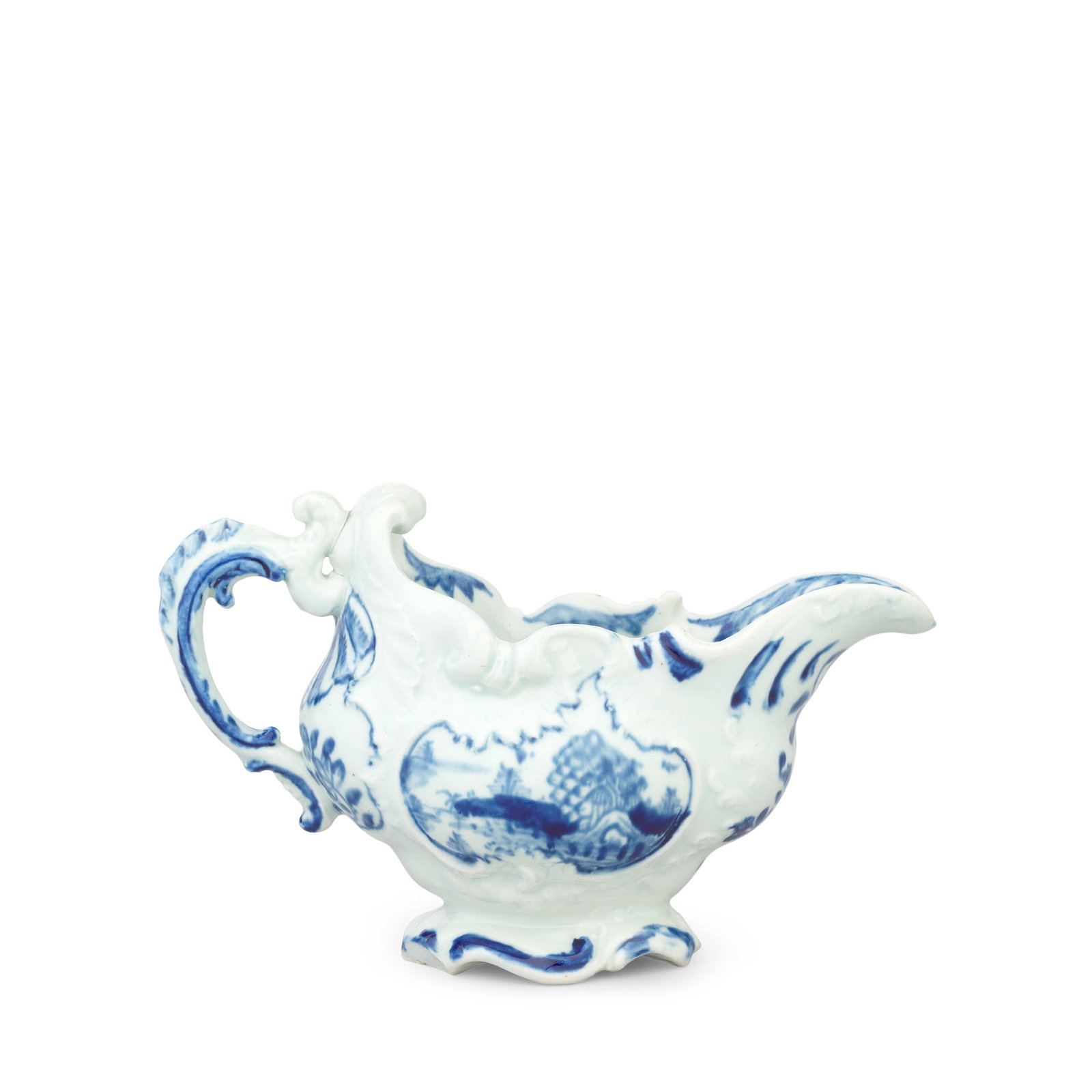 A rare Vauxhall small sauceboat, circa 1758-60: A rare Vauxhall small sauceboat, circa 1758-60 Of rococo scroll-moulded form on a low foot and with a shell-moulded scroll handle with details picked out in blue, reserved to both sides with panels pa