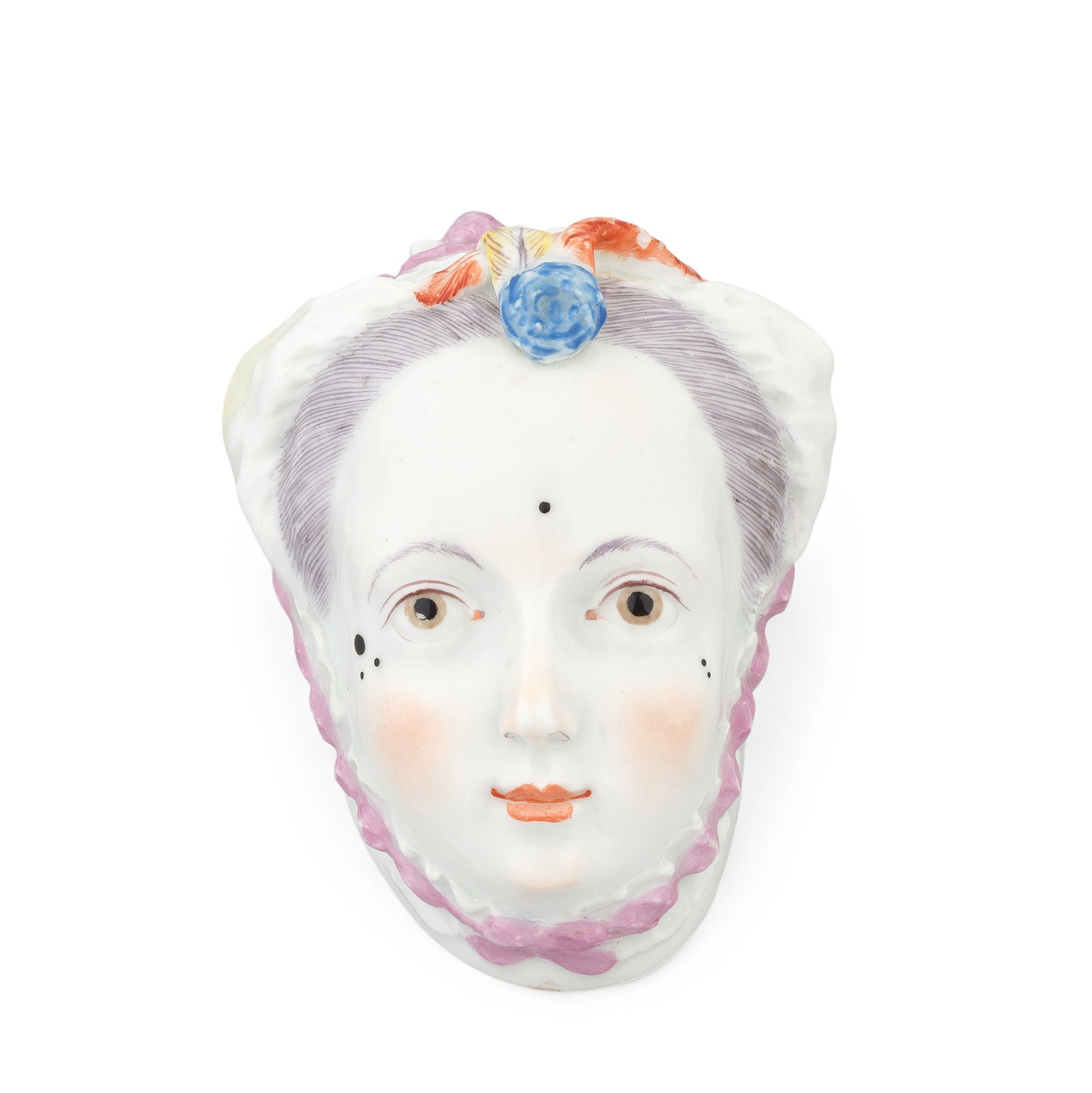 A Chelsea bonbonnière, circa 1755: A Chelsea bonbonnière, circa 1755 Modelled as a lady's head, wearing a frilled bonnet laced with pink and yellow ribbons, a rosette and three feathers secured at the front, her face delicately co