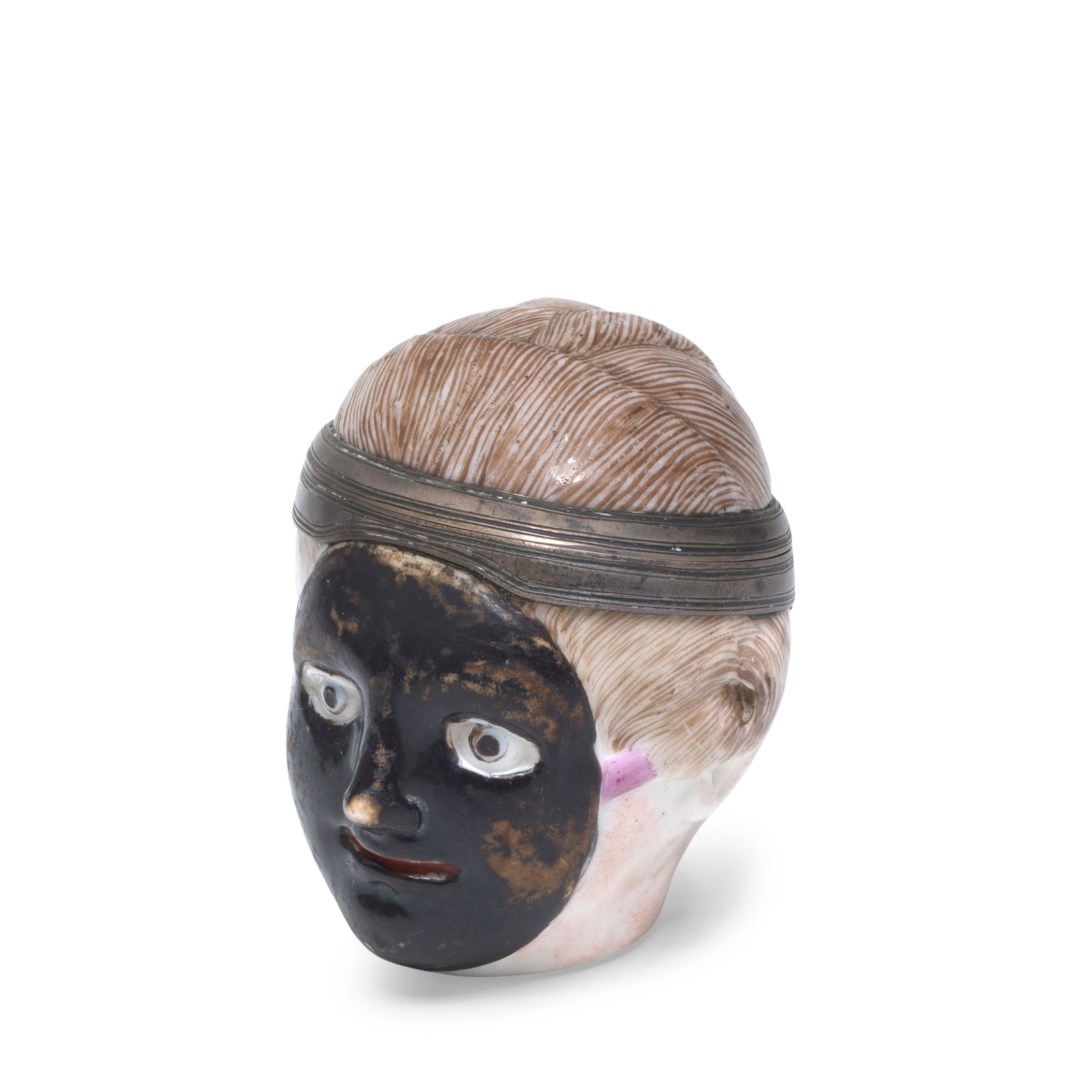 A very rare Cozzi or Le Nove bonbonnière or pill-box, circa 1770: A very rare Cozzi or Le Nove bonbonnière or pill-box, circa 1770 Modelled as a lady's head, wearing a black theatre mask, held with puce straps and tied in with her hair at the back, the inside w
