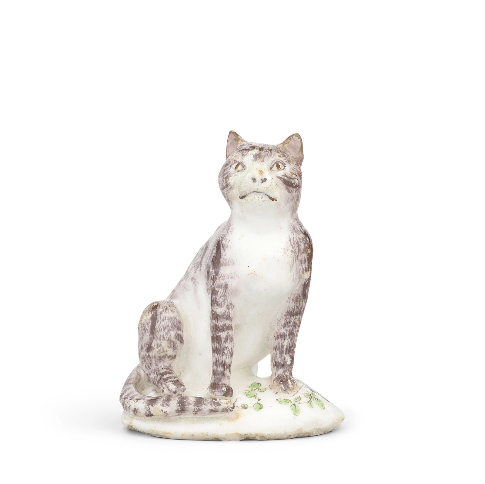 A Bow model of a cat, circa 1758-60: A Bow model of a cat, circa 1758-60 Modelled seated and with an alert expression, its fur delicately painted in brown with tabby stripes, its eyes subtly picked out in yellow, on a simple mound base p