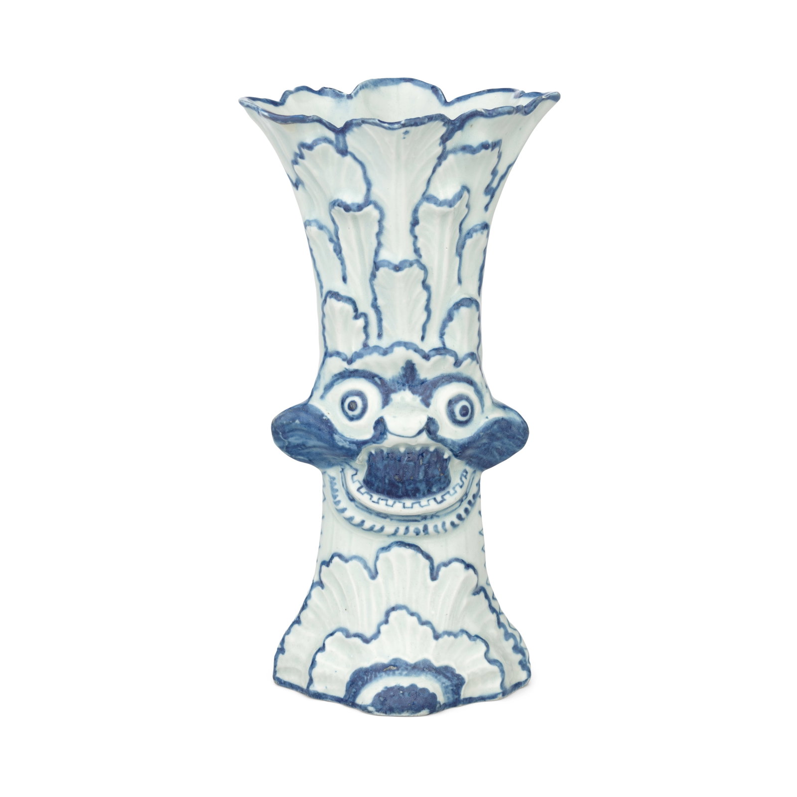 An extraordinary Limehouse vase, circa 1746-48: An extraordinary Limehouse vase, circa 1746-48 Of beaker form and diamond section, moulded to both sides with a grotesque mask with protruding ears and tongue, and wide round eyes, forming a bird-like