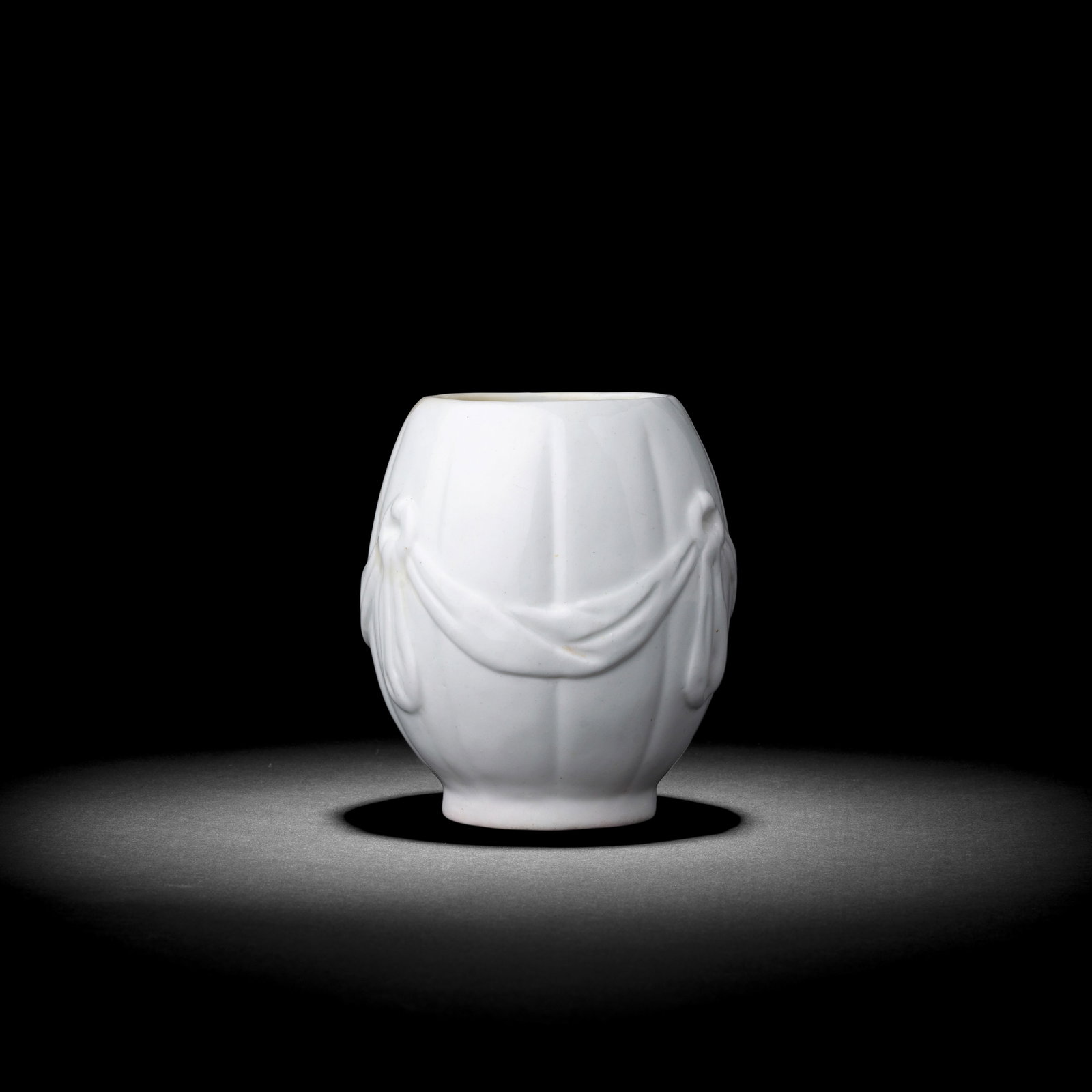 An exceptionally rare St James's (Charles Gouyn) white tea canister, circa 1751: An exceptionally rare St James's (Charles Gouyn) white tea canister, circa 1751 The gently lobed, ovoid body moulded with swags of drapery loosely suspended from loops, 9.4cm high Footnotes: Provenanc
