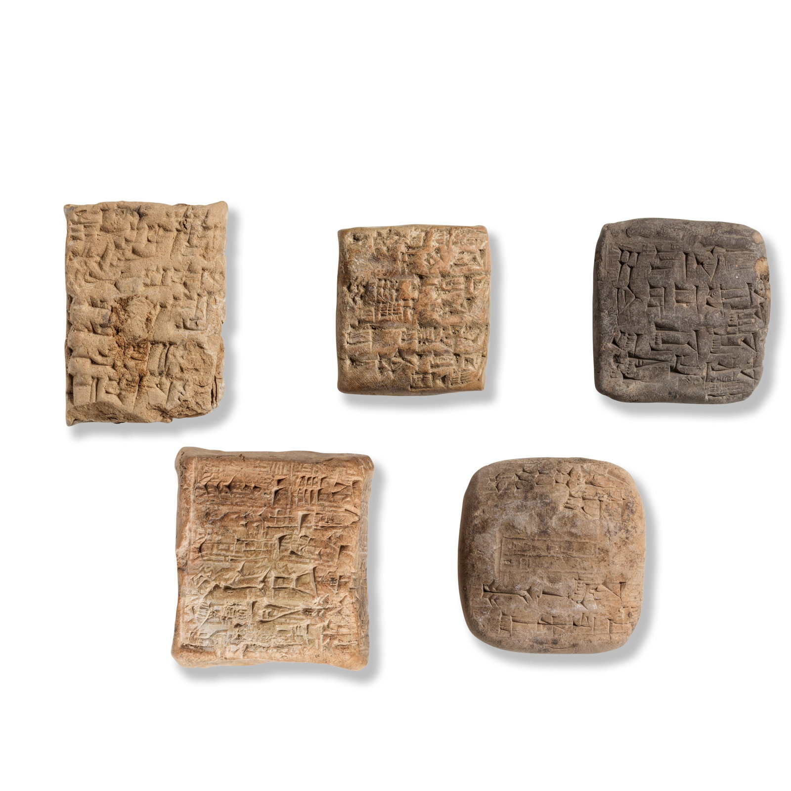 Four Neo-Assyrian and one Old Babylonian terracotta cuneiform tablets 6: Four Neo-Assyrian and one Old Babylonian terracotta cuneiform tablets 3rd Dynasty of Ur, circa 2050-2020 B.C. - Old Babylonian, circa 1900-1700 B.C. Including a complete square clay envelope tablet, r