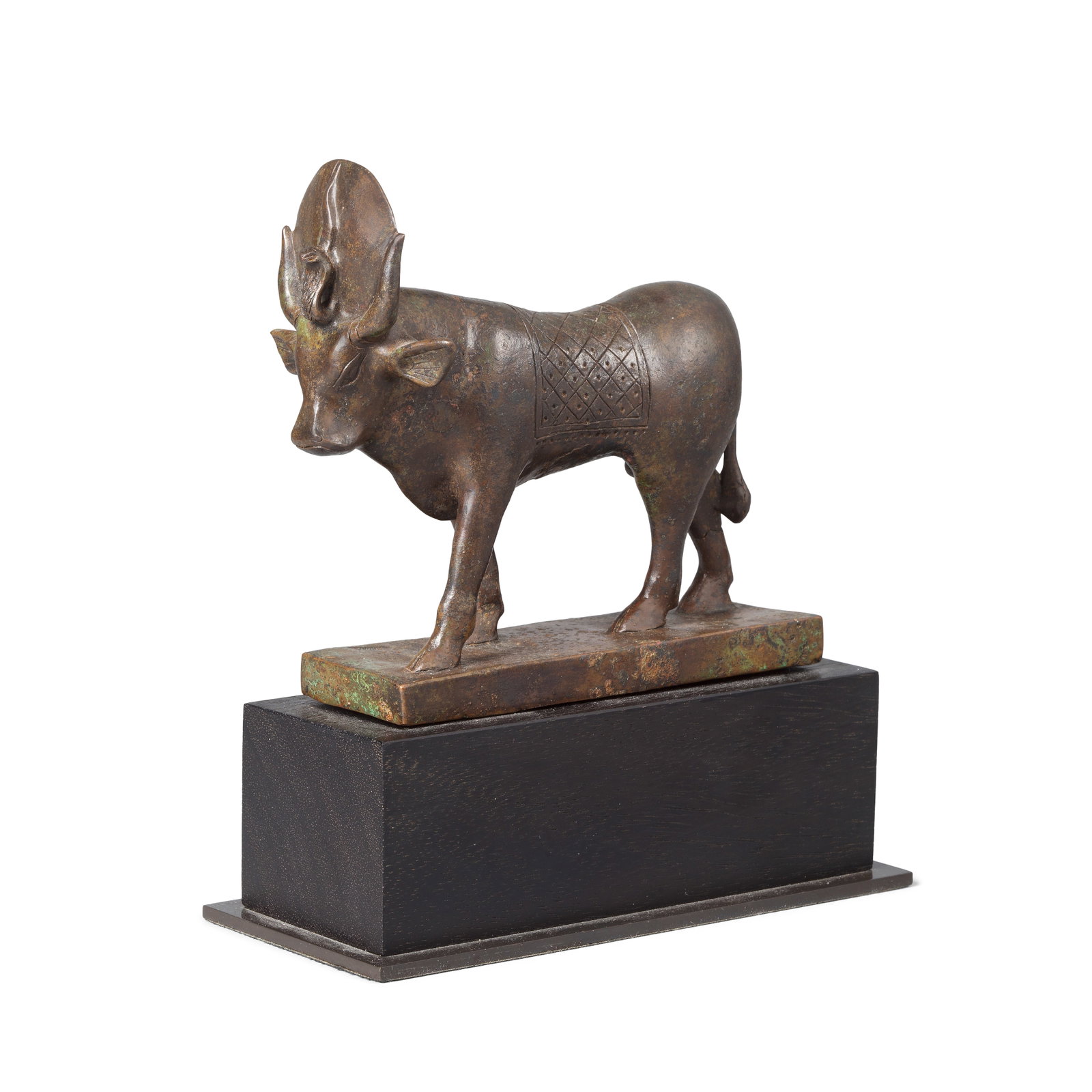 An Egyptian bronze Mnevis bull: An Egyptian bronze Mnevis bull Late Period, circa 664-332 B.C. 14cm long, 12.5cm high Footnotes: Provenance: Private collection, France. Anonymous sale; Piasa, Drouot Richelieu, Paris, 13 April 2005, 